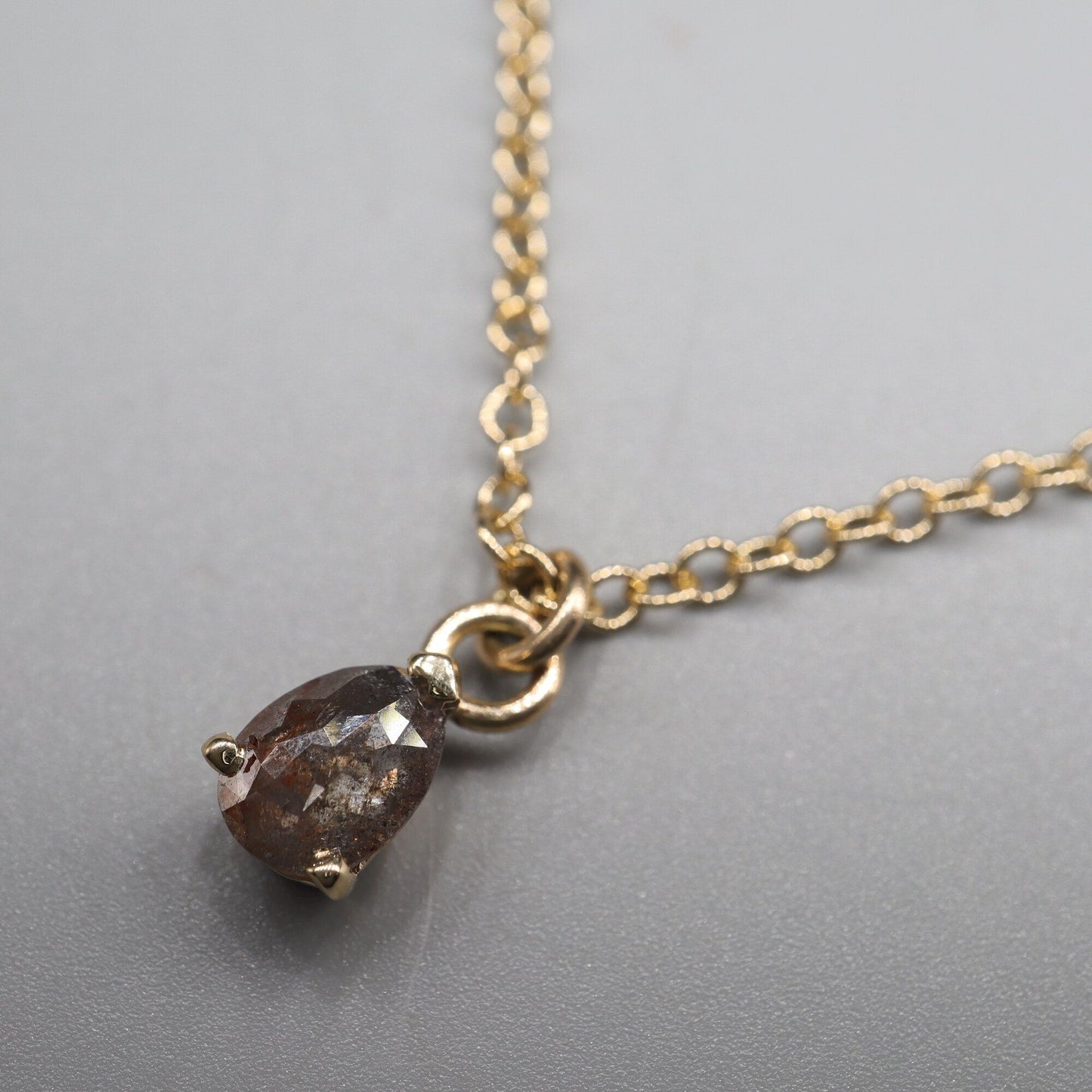 Salt and Pepper pear shaped diamond pendant in yellow gold with chain