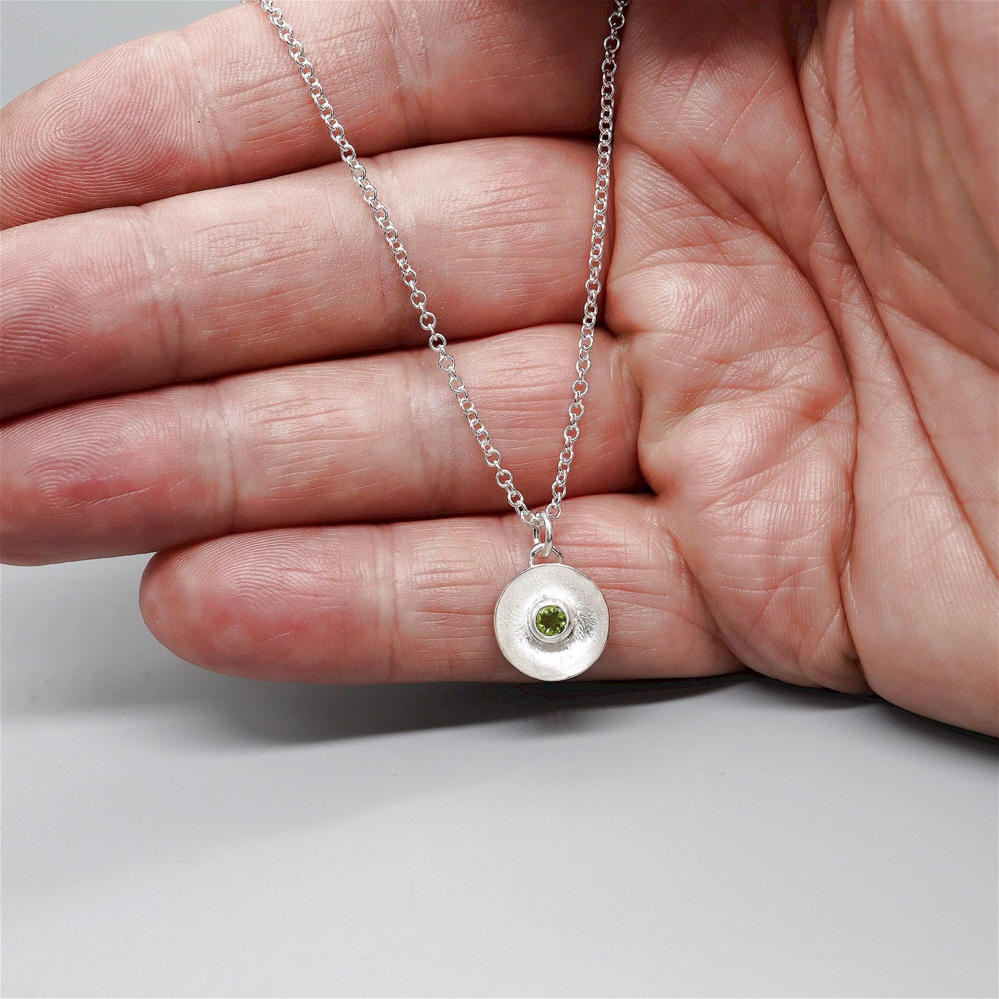 Peridot pendant, silver Water Droplets design.