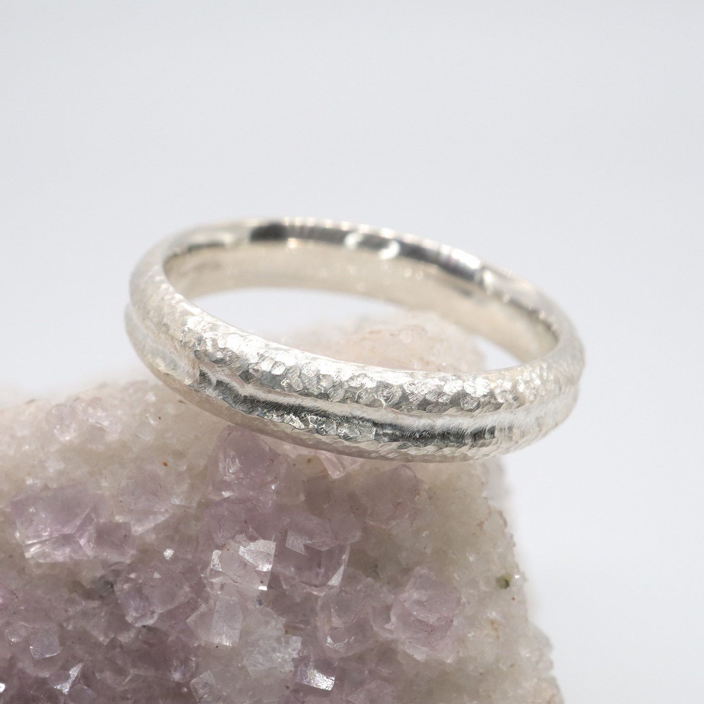 White gold narrow wedding ring with a carved rustic pattern, Fleetwith Pike design.