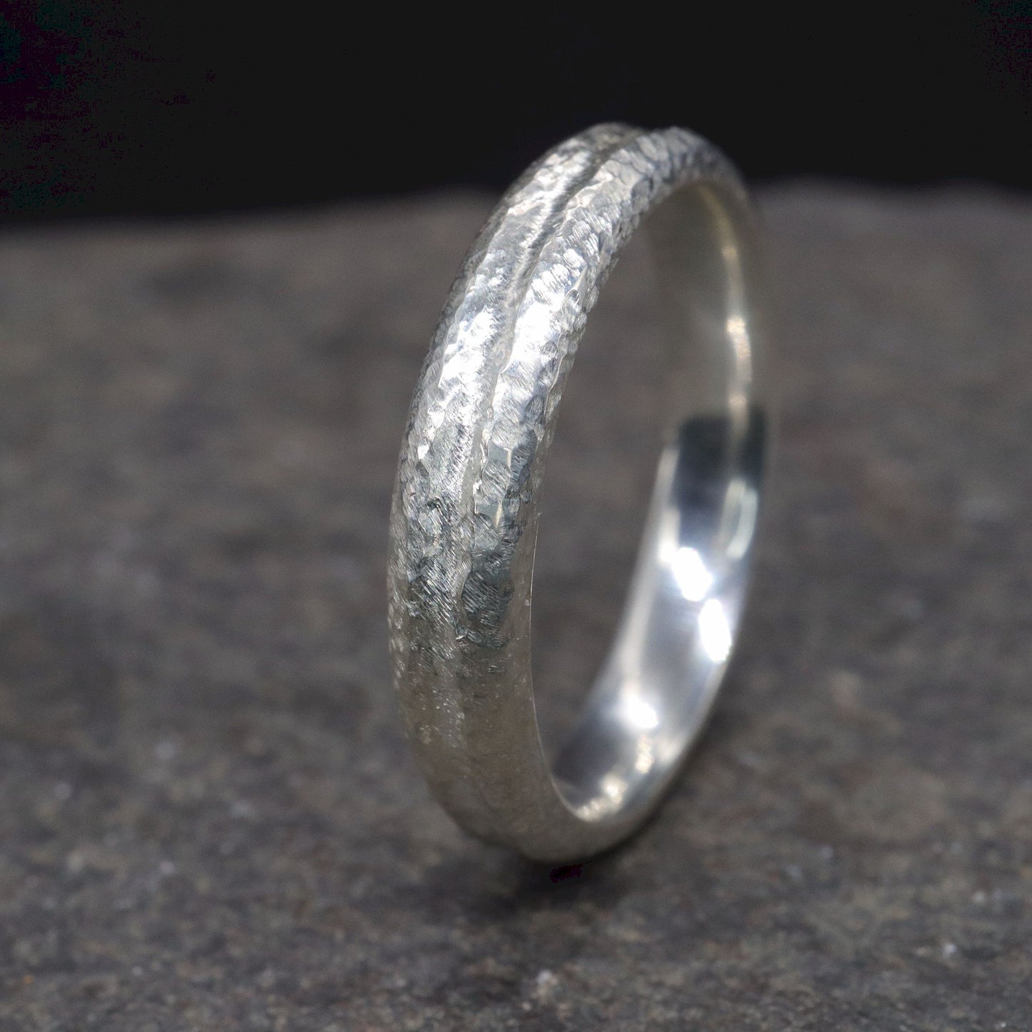 White gold narrow wedding ring with a carved rustic pattern, Fleetwith Pike design.