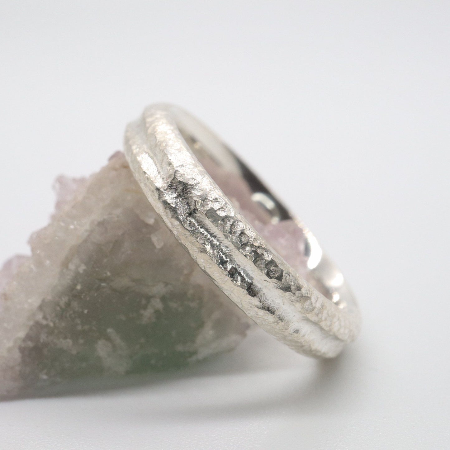 White gold narrow wedding ring with a carved rustic pattern, Fleetwith Pike design.