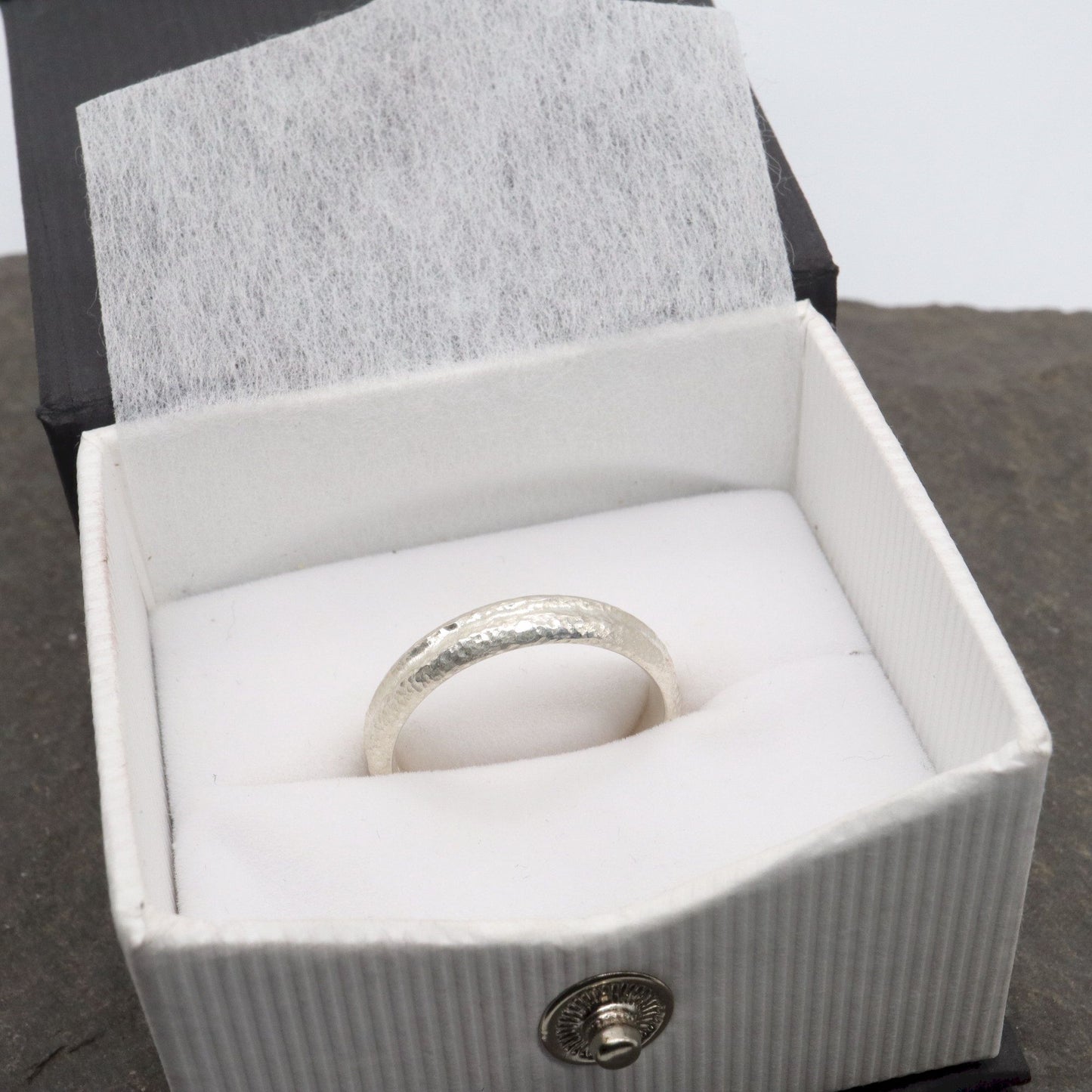 White gold narrow wedding ring with a carved rustic pattern, Fleetwith Pike design.