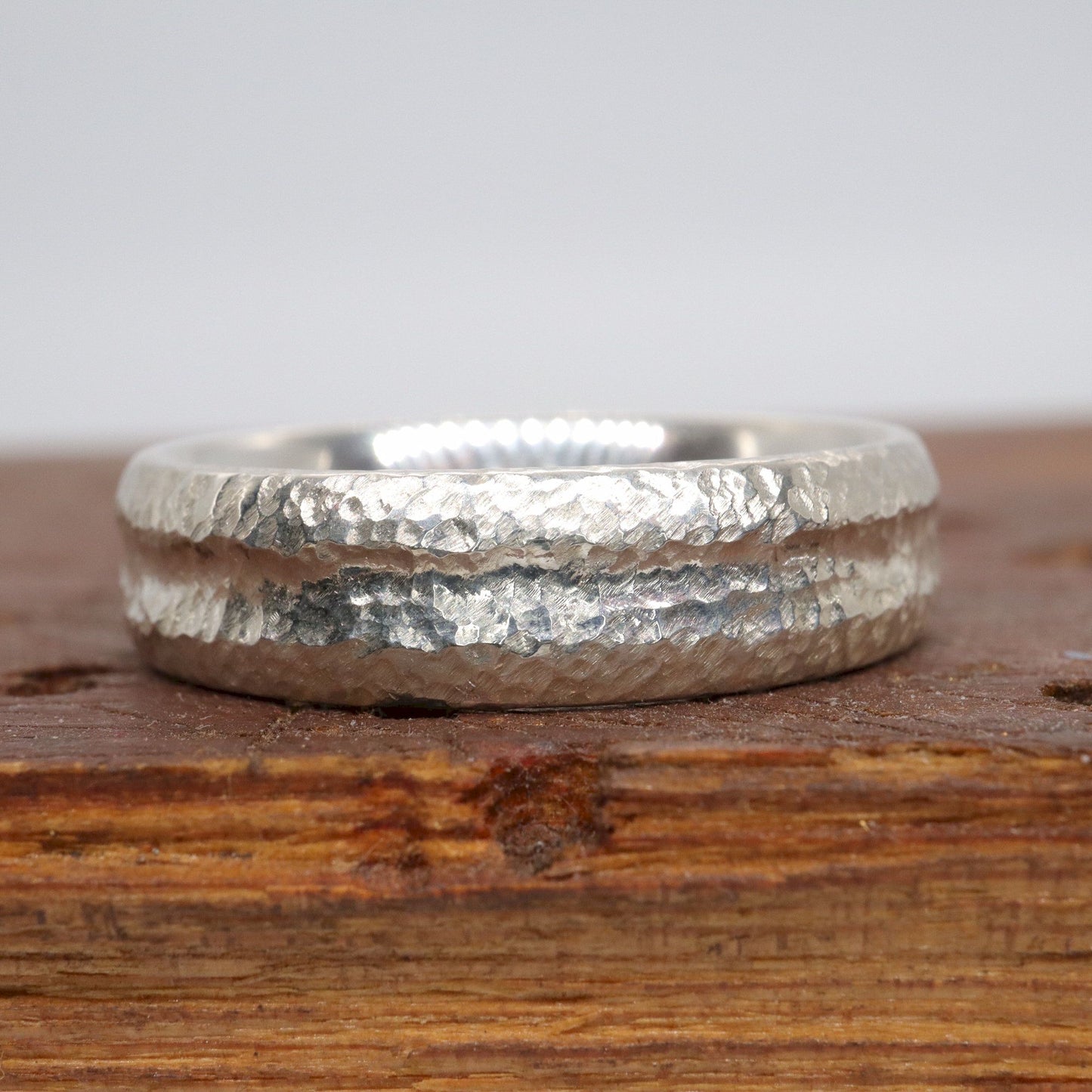 Silver mans promise, engagement or wedding ring with a carved rustic pattern, Fleetwith Pike design.