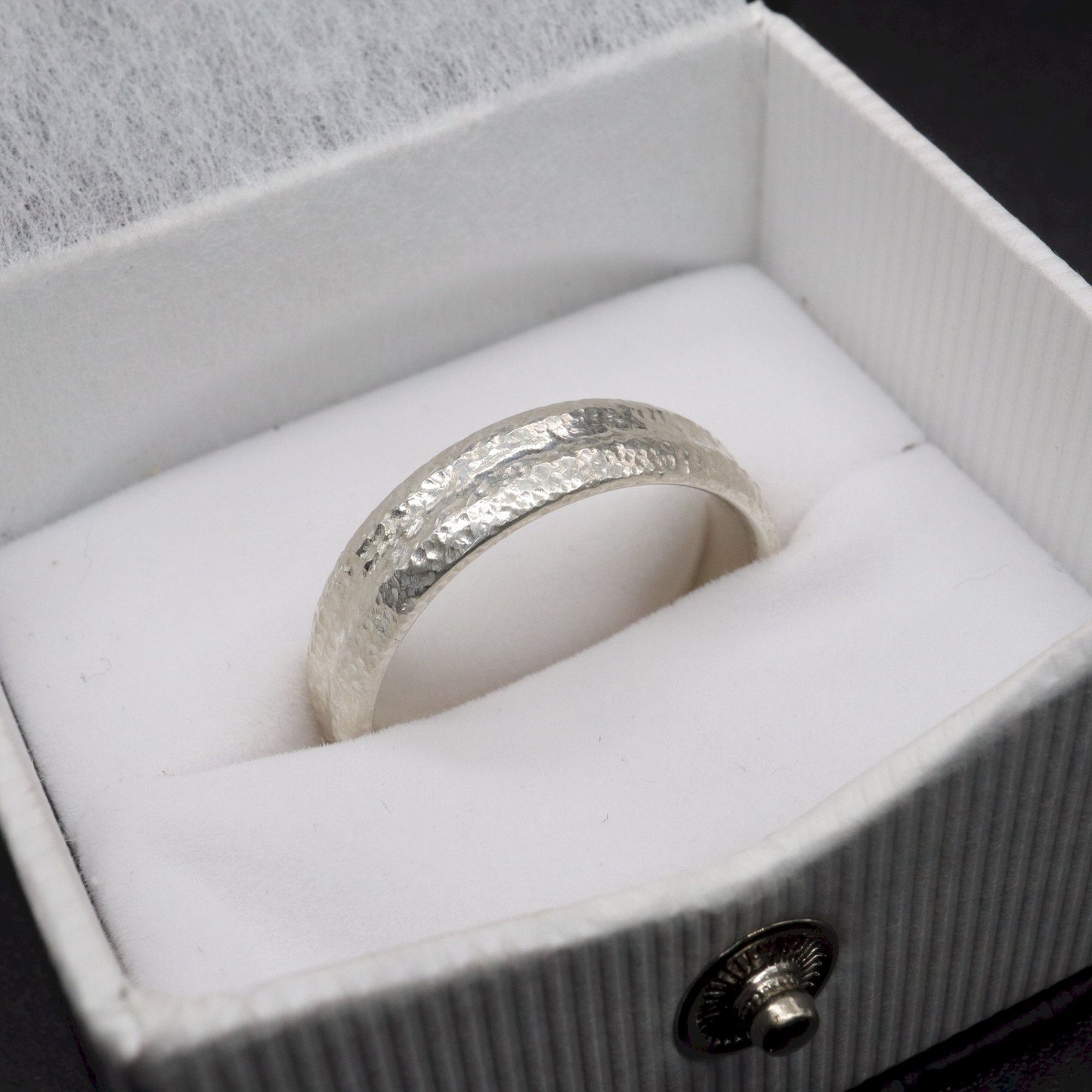 White gold wide wedding ring with a carved rustic pattern, Fleetwith Pike design.