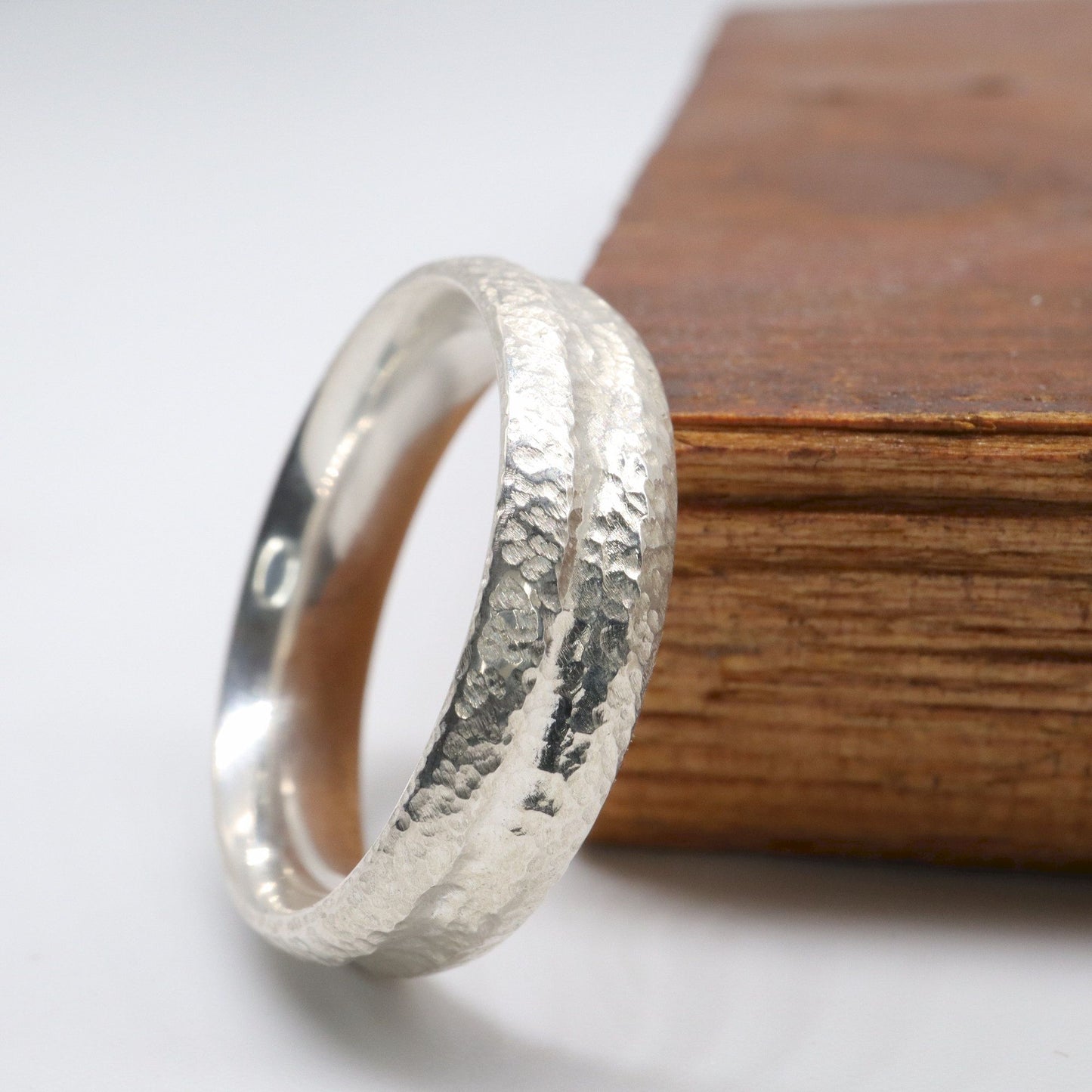 Silver mans promise, engagement or wedding ring with a carved rustic pattern, Fleetwith Pike design.