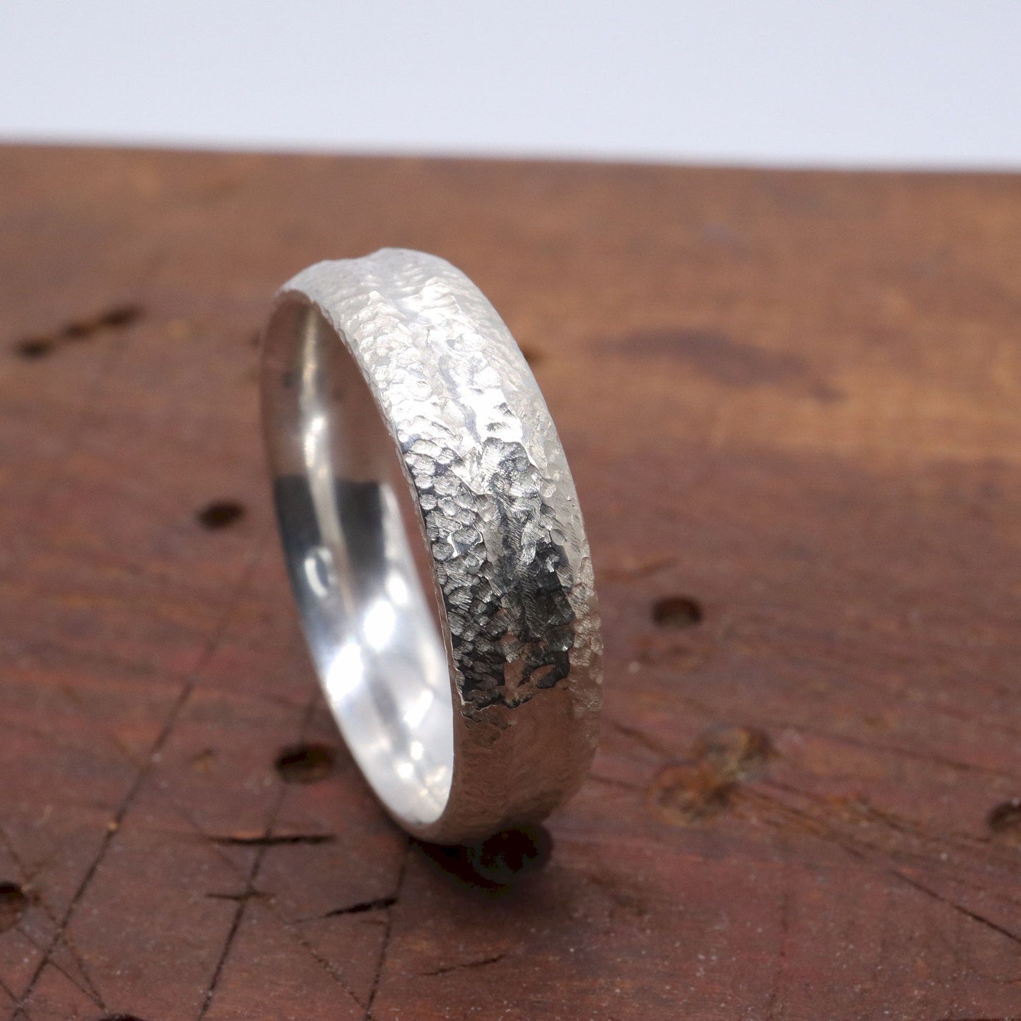 Silver mans promise, engagement or wedding ring with a carved rustic pattern, Fleetwith Pike design.