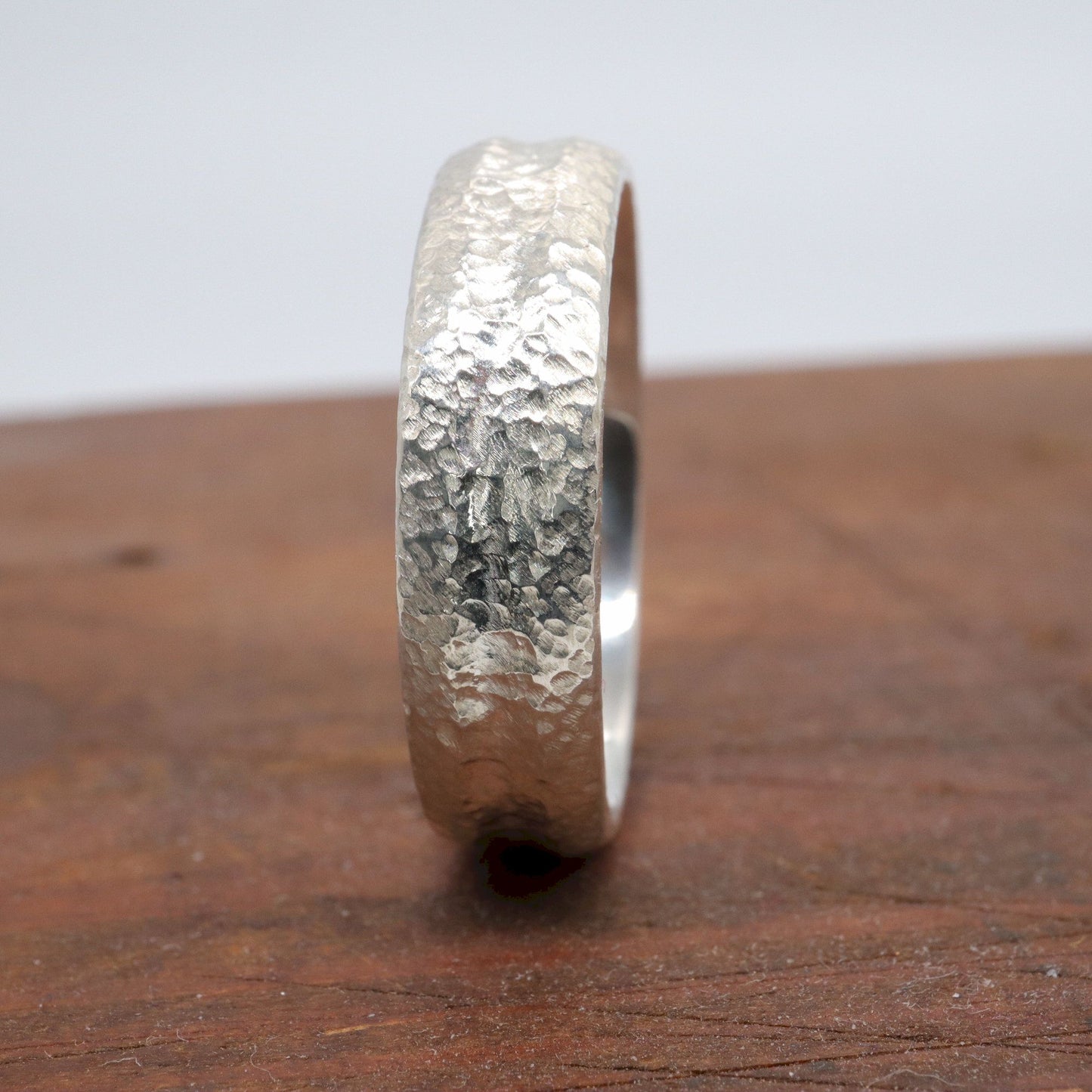 Silver mans promise, engagement or wedding ring with a carved rustic pattern, Fleetwith Pike design.