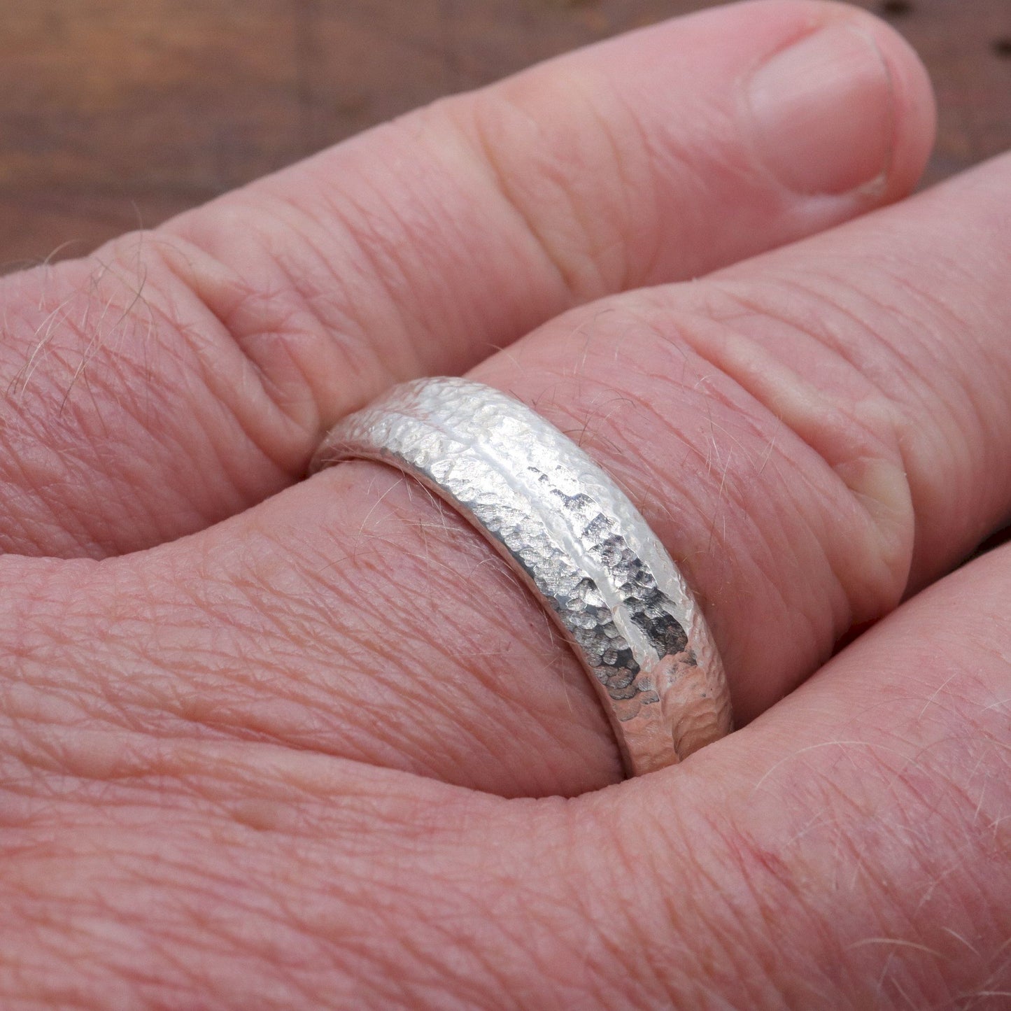 Silver mans promise, engagement or wedding ring with a carved rustic pattern, Fleetwith Pike design.