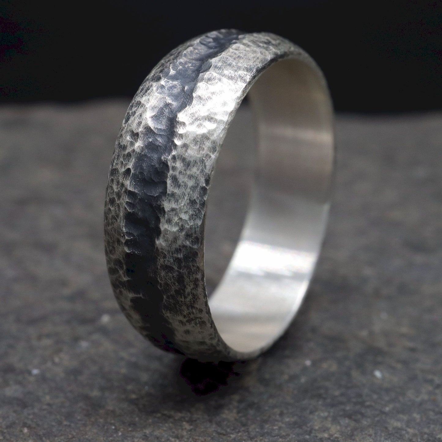 Black silver mans promise, engagement or wedding ring with a carved rustic pattern, Fleetwith Pike design.