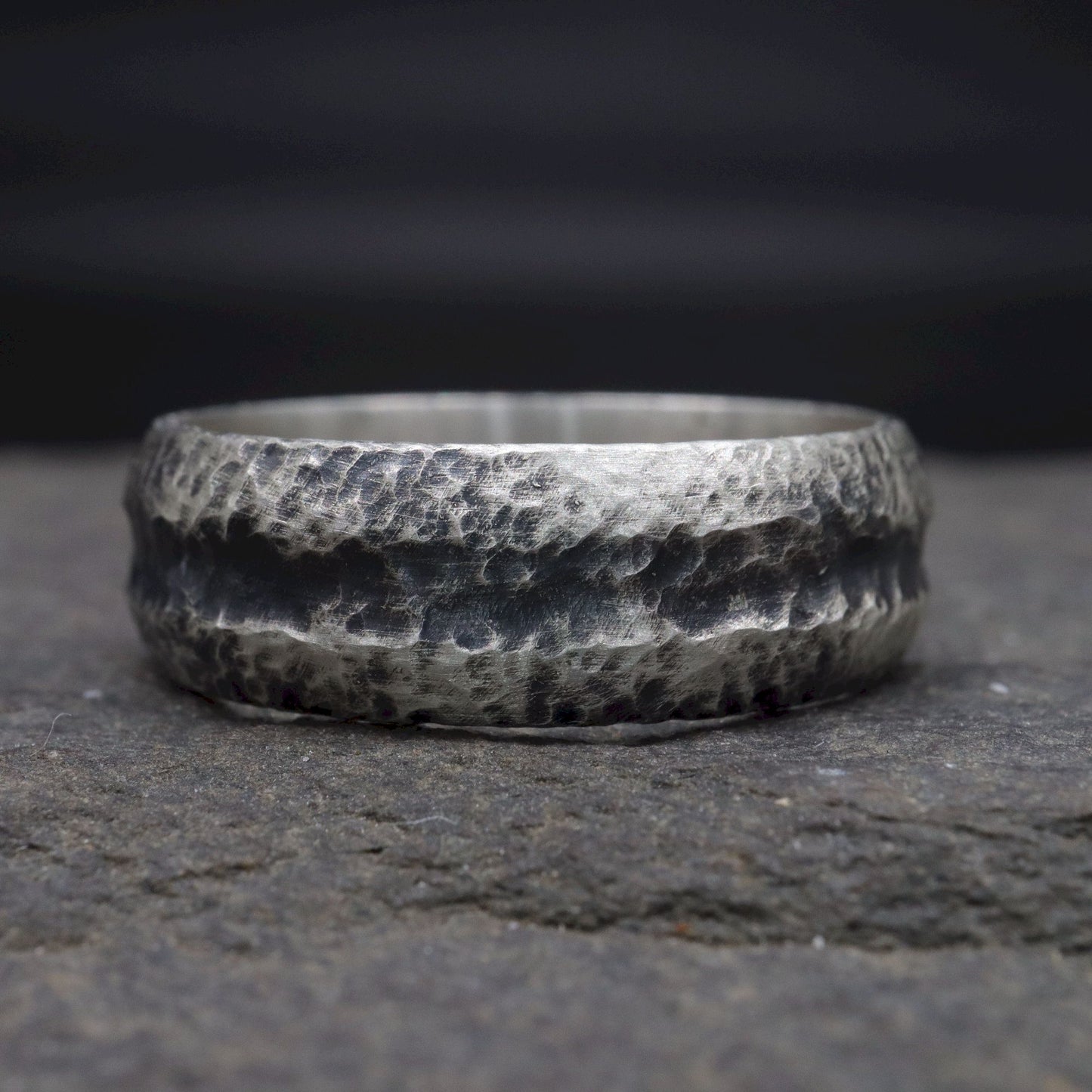 Black silver mans promise, engagement or wedding ring with a carved rustic pattern, Fleetwith Pike design.