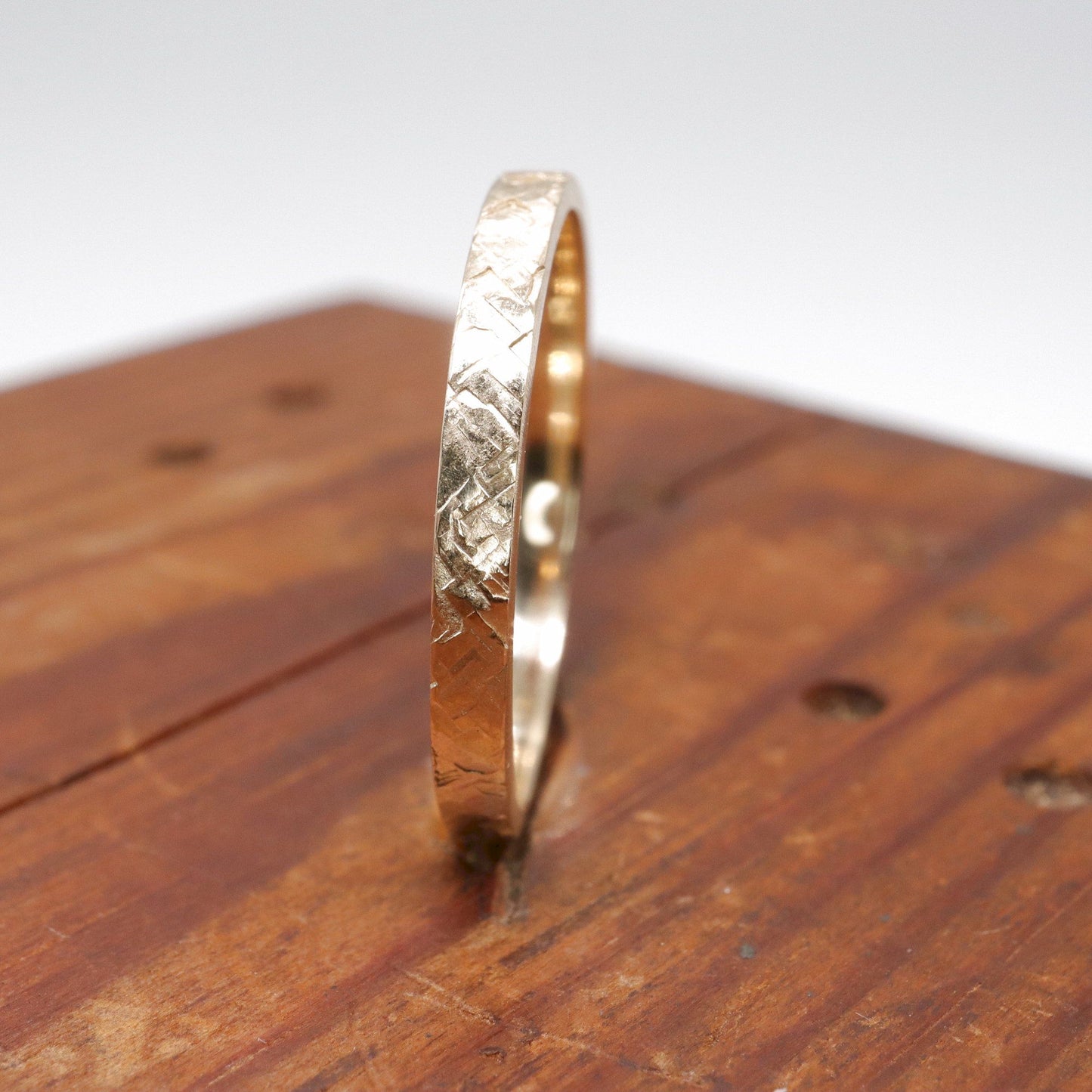 Narrow fine wedding ring, yellow gold Kendal design rustic hammered style for a woman or man