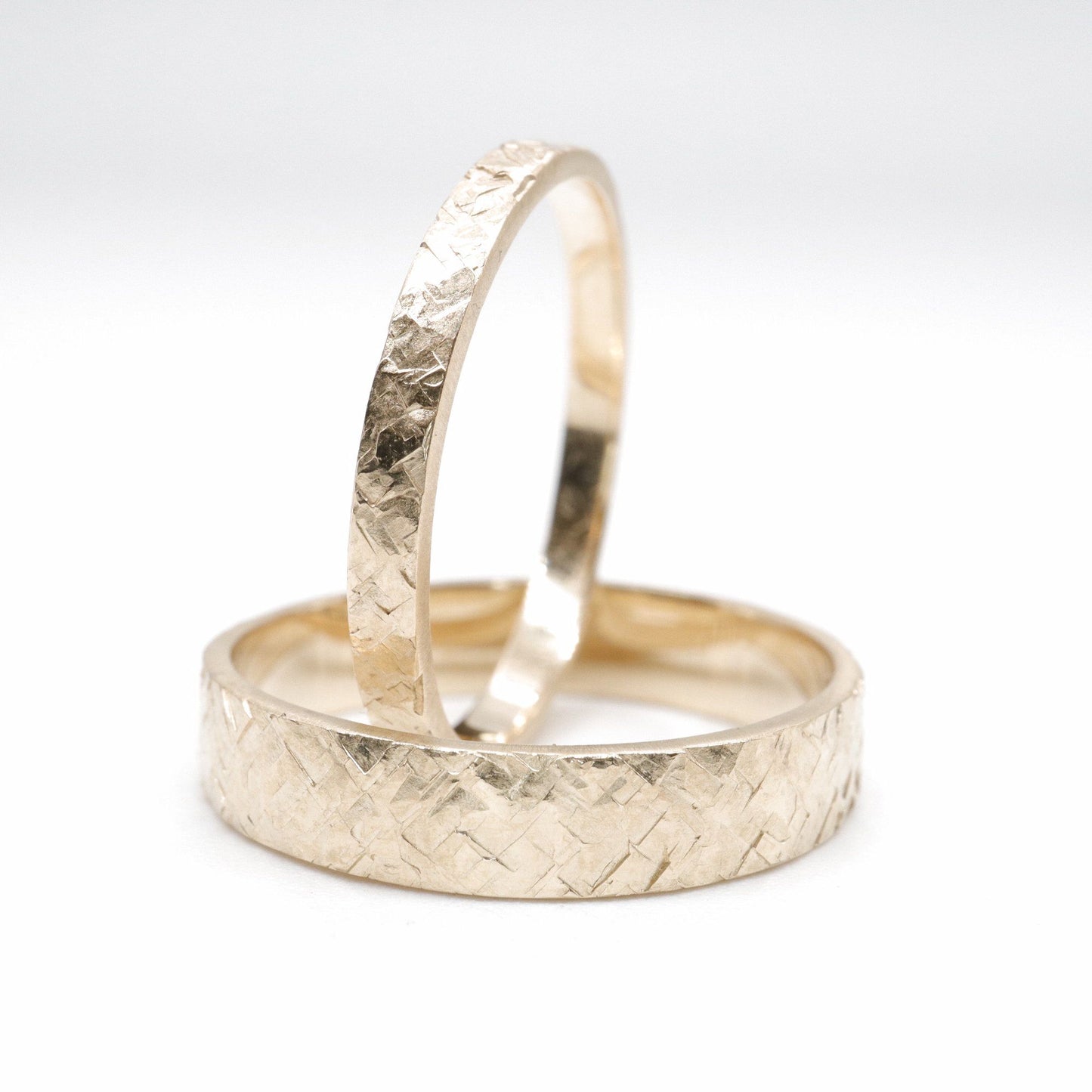 Yellow gold matching Kendal rustic hammered 2mm and 4mm wedding ring set - flat textured men and womens design.