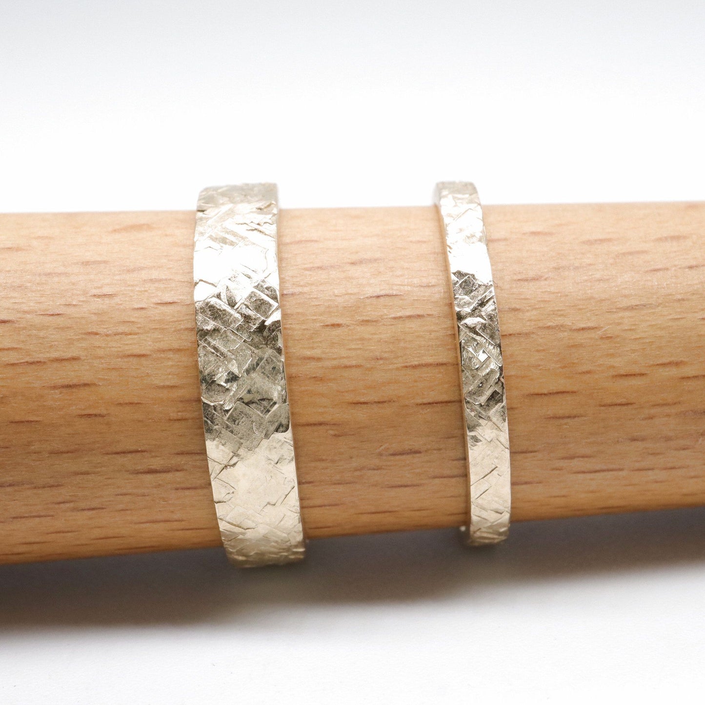 Yellow gold matching Kendal rustic hammered 2mm and 4mm wedding ring set - flat textured men and womens design.