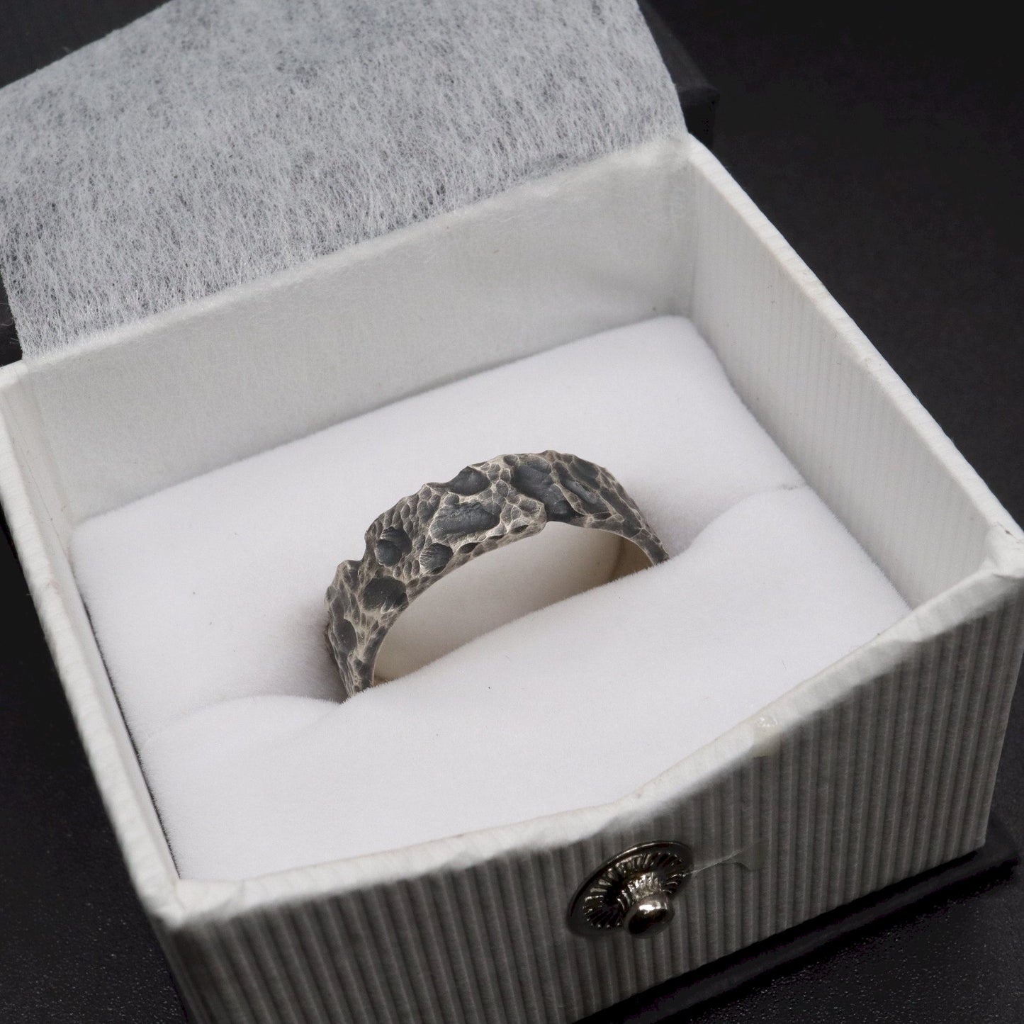 Lakeland Rock mens wedding, promise or engagement ring with a hand carved design.