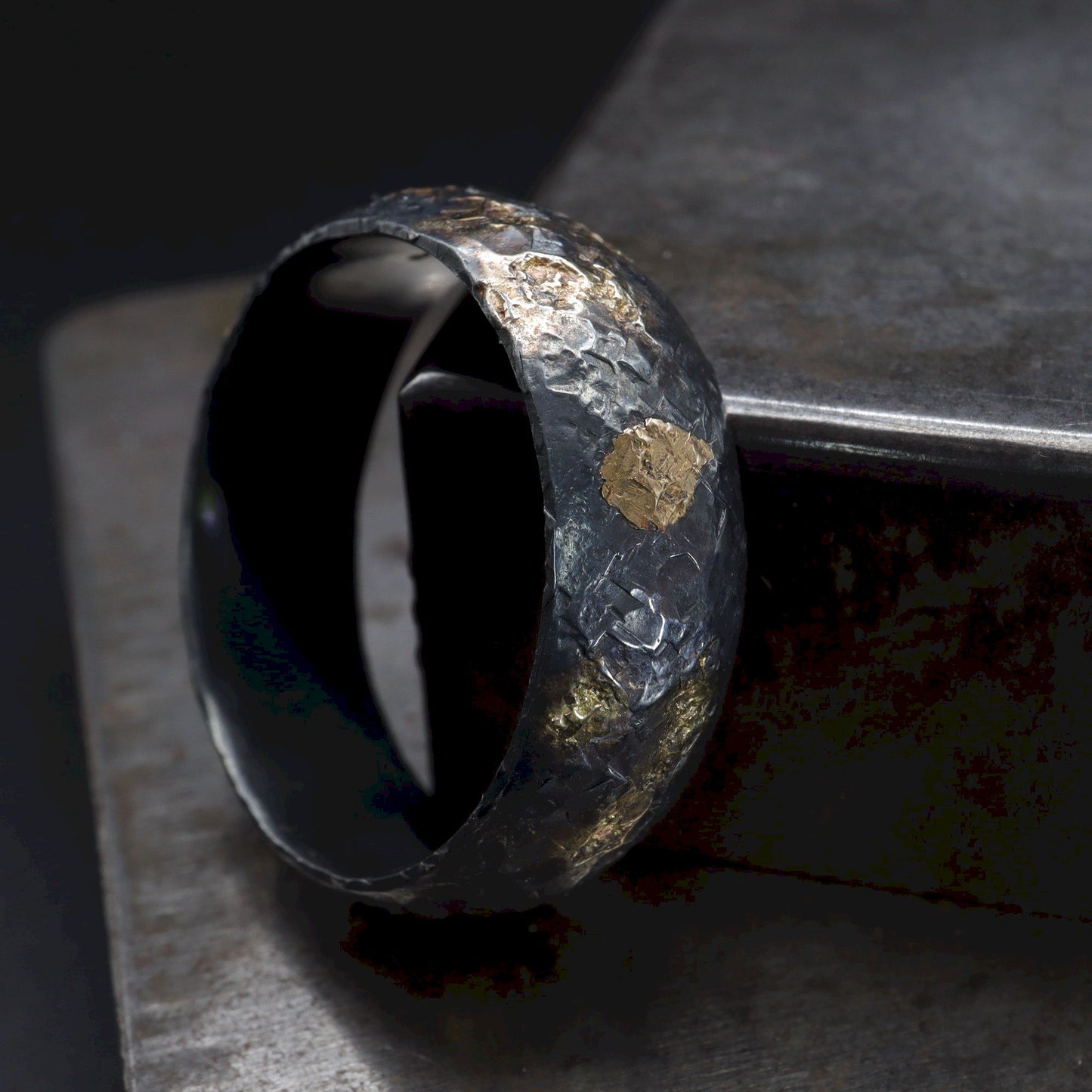 Wedding ring, black silver and gold hammered Night Sky design.