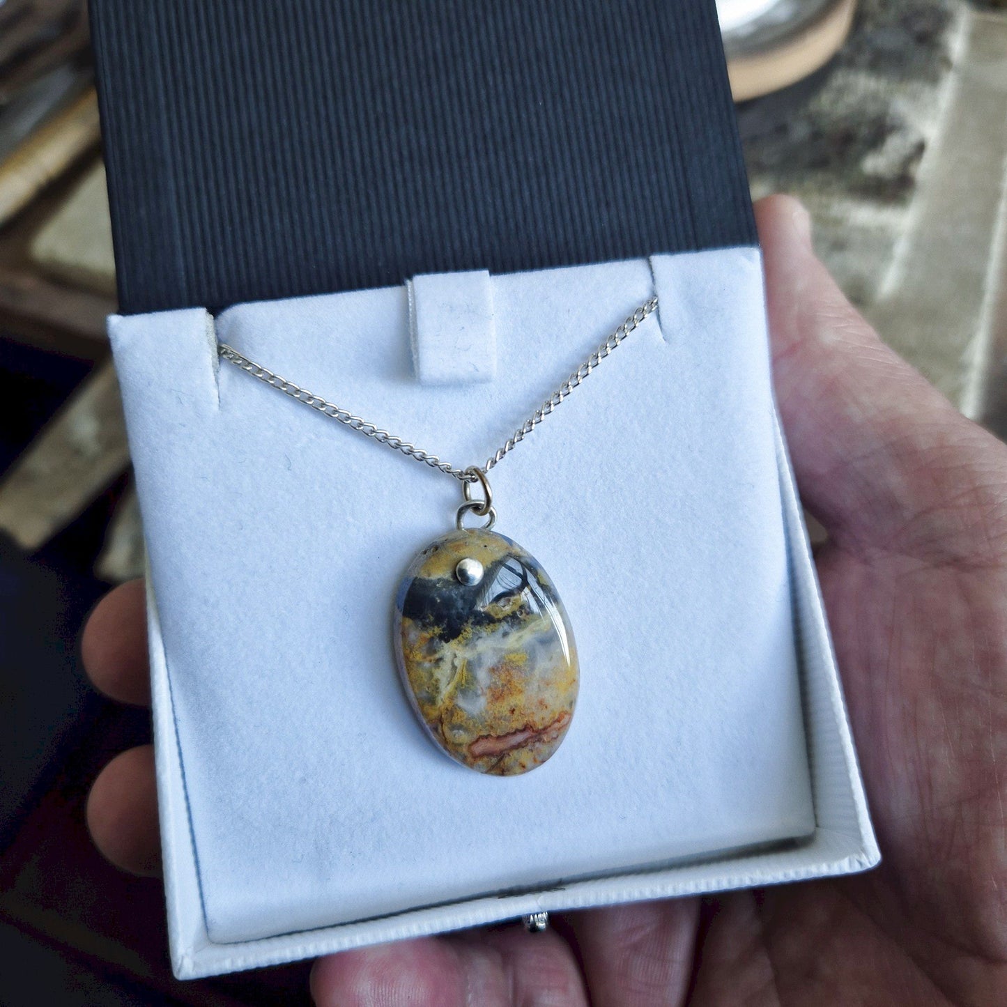Orange and Black Lace Agate oval pendant