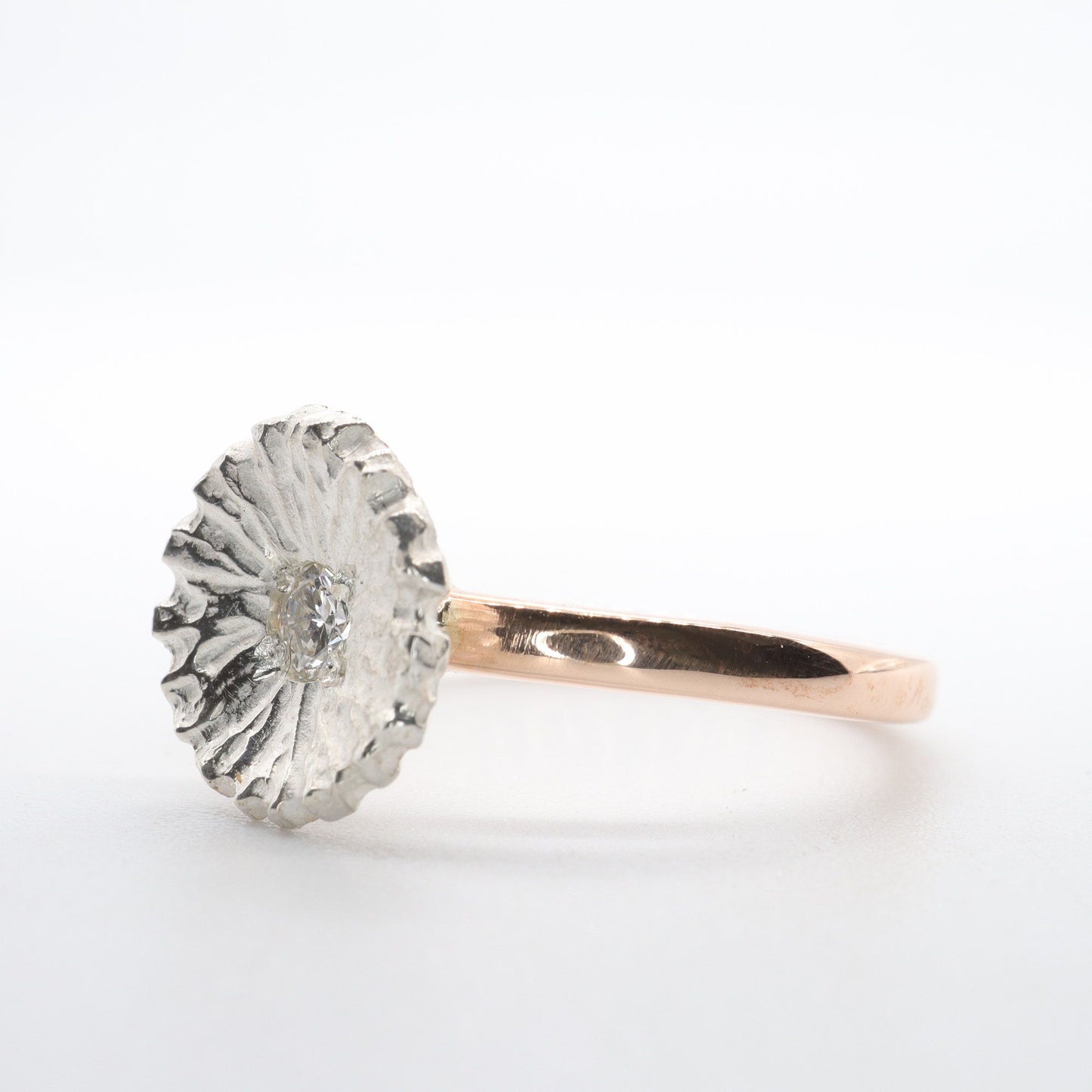 Diamond set rose gold Water Lilies solitaire ring.