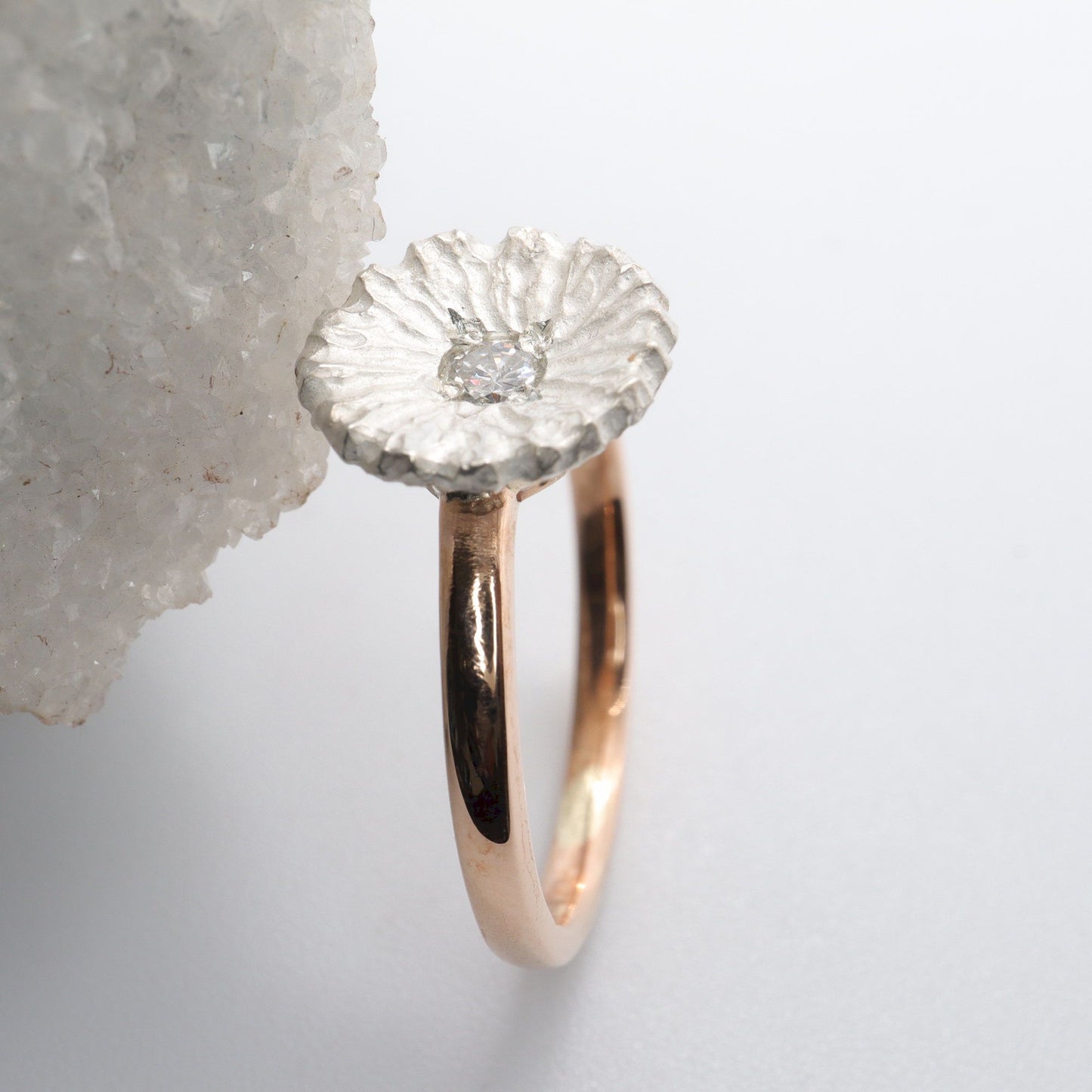 Diamond set rose gold Water Lilies solitaire ring.