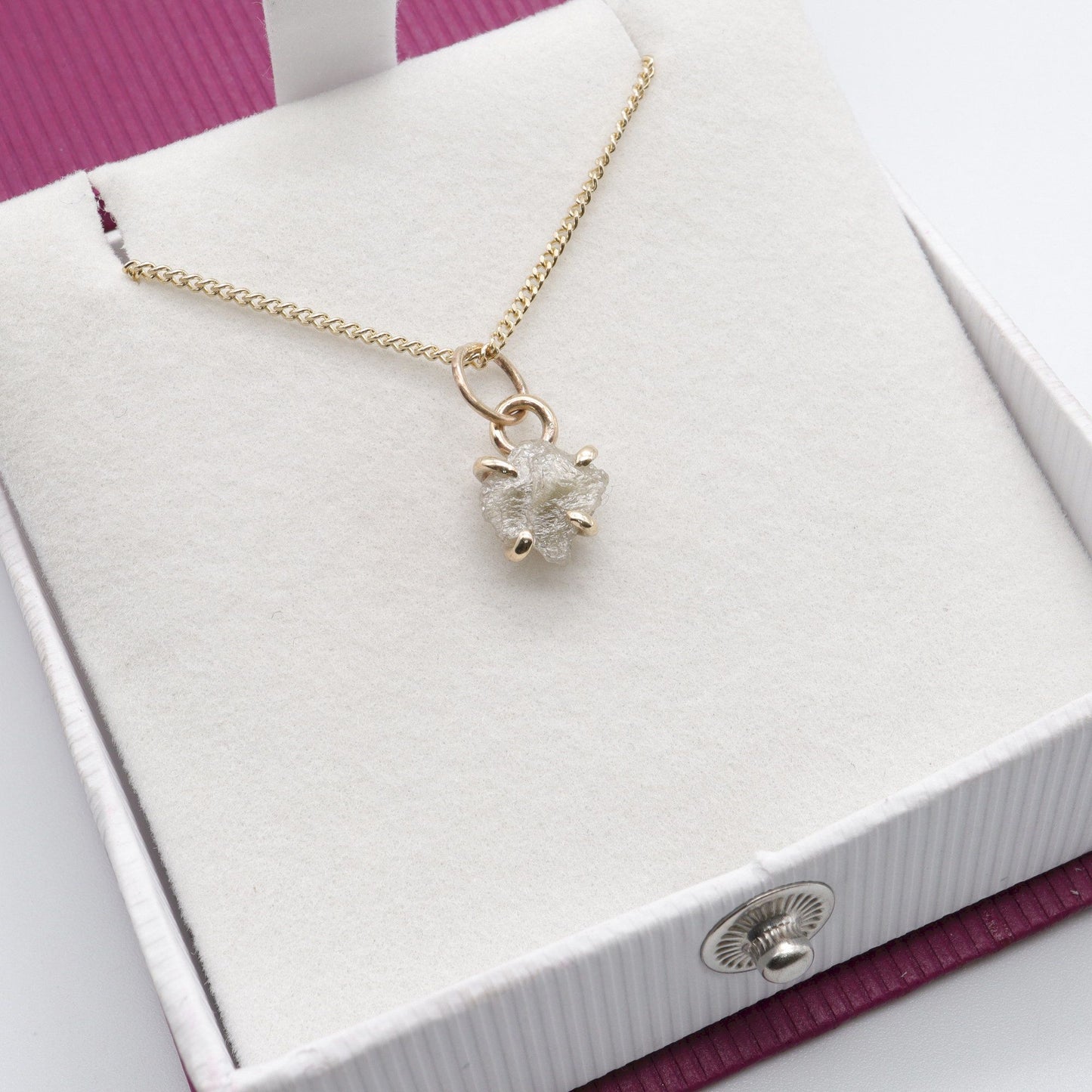 Diamond gold pendant set with one raw uncut natural diamond