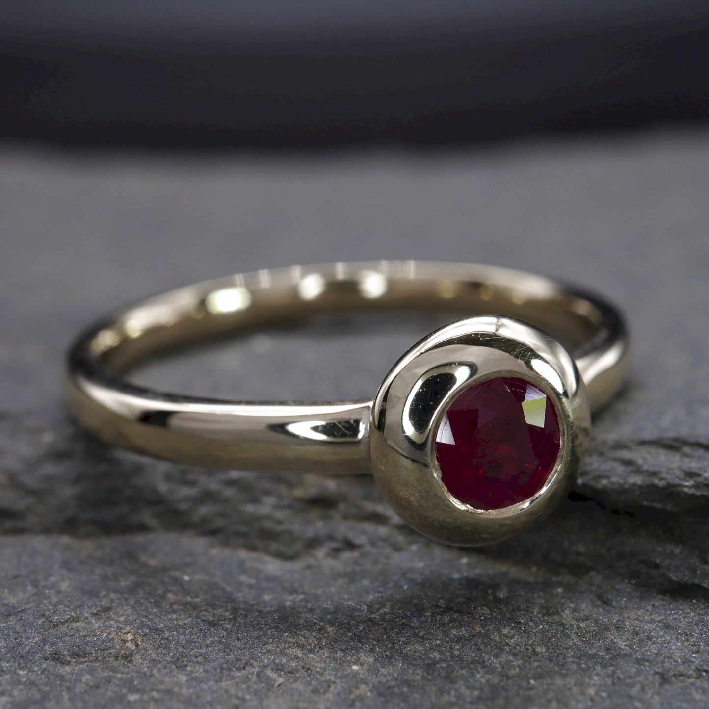 Solitaire fine Ruby engagement ring in yellow gold.