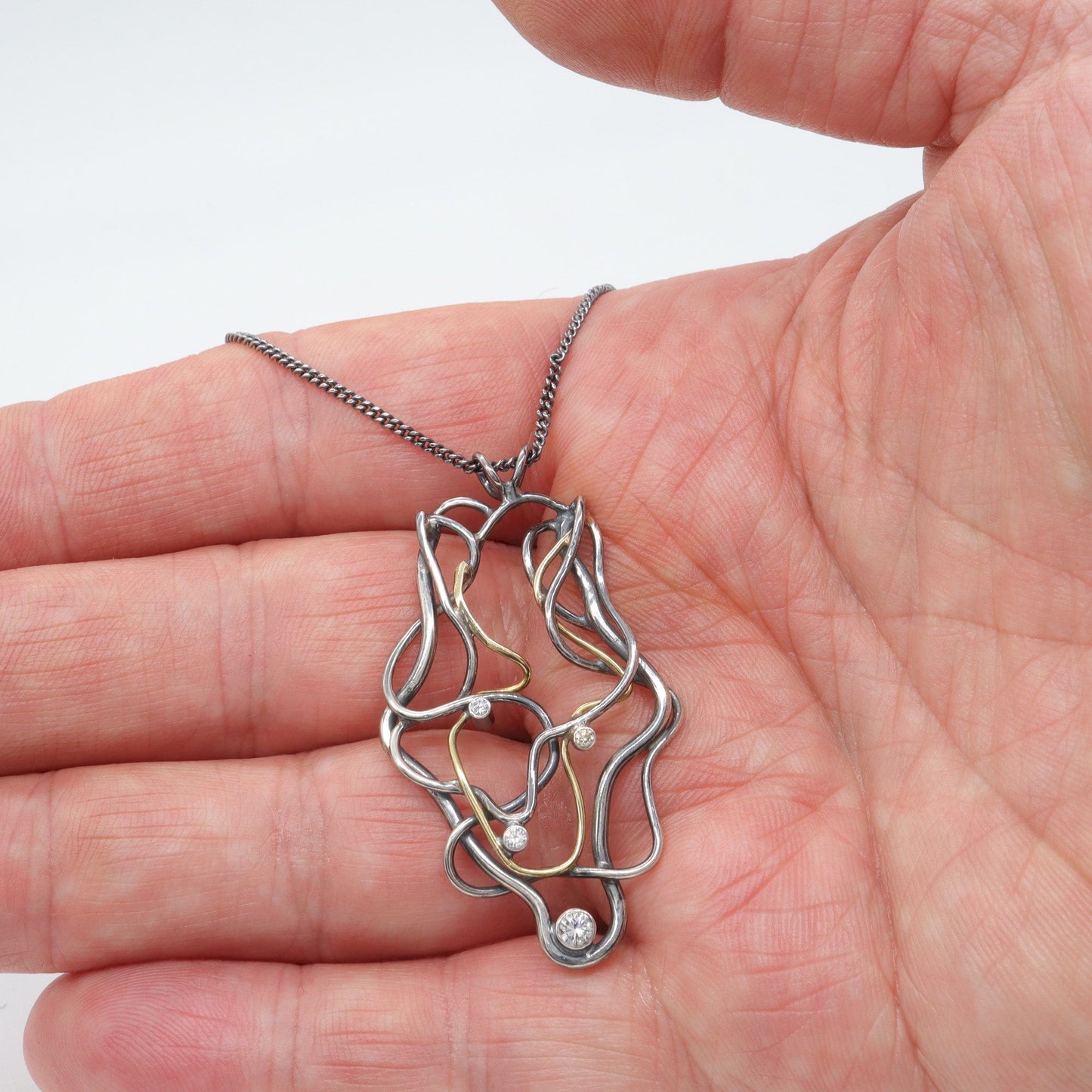 Diamond set 18ct gold and antique dark stained silver handmade necklace