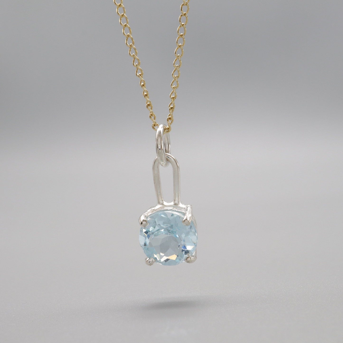 Sky blue Topaz silver and gold handmade drop pendant