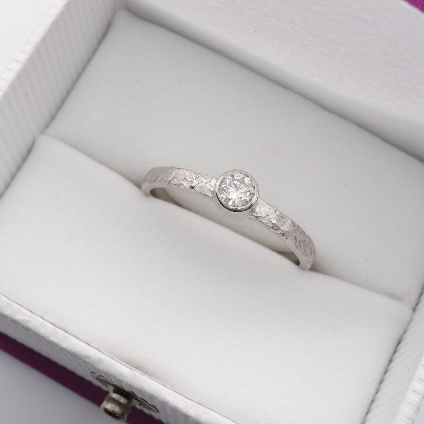 Solitaire quarter carat diamond Fire design white gold ring