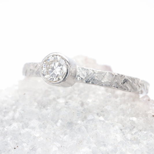 Solitaire quarter carat diamond Fire design white gold ring