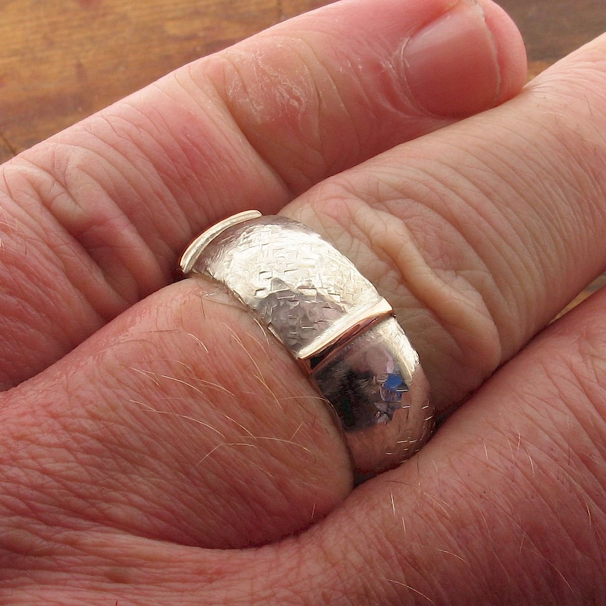 Rustic 8mm wedding ring in rose gold and silver, Lakeland Mine White design. Designer Wedding Rings Wedding Ring