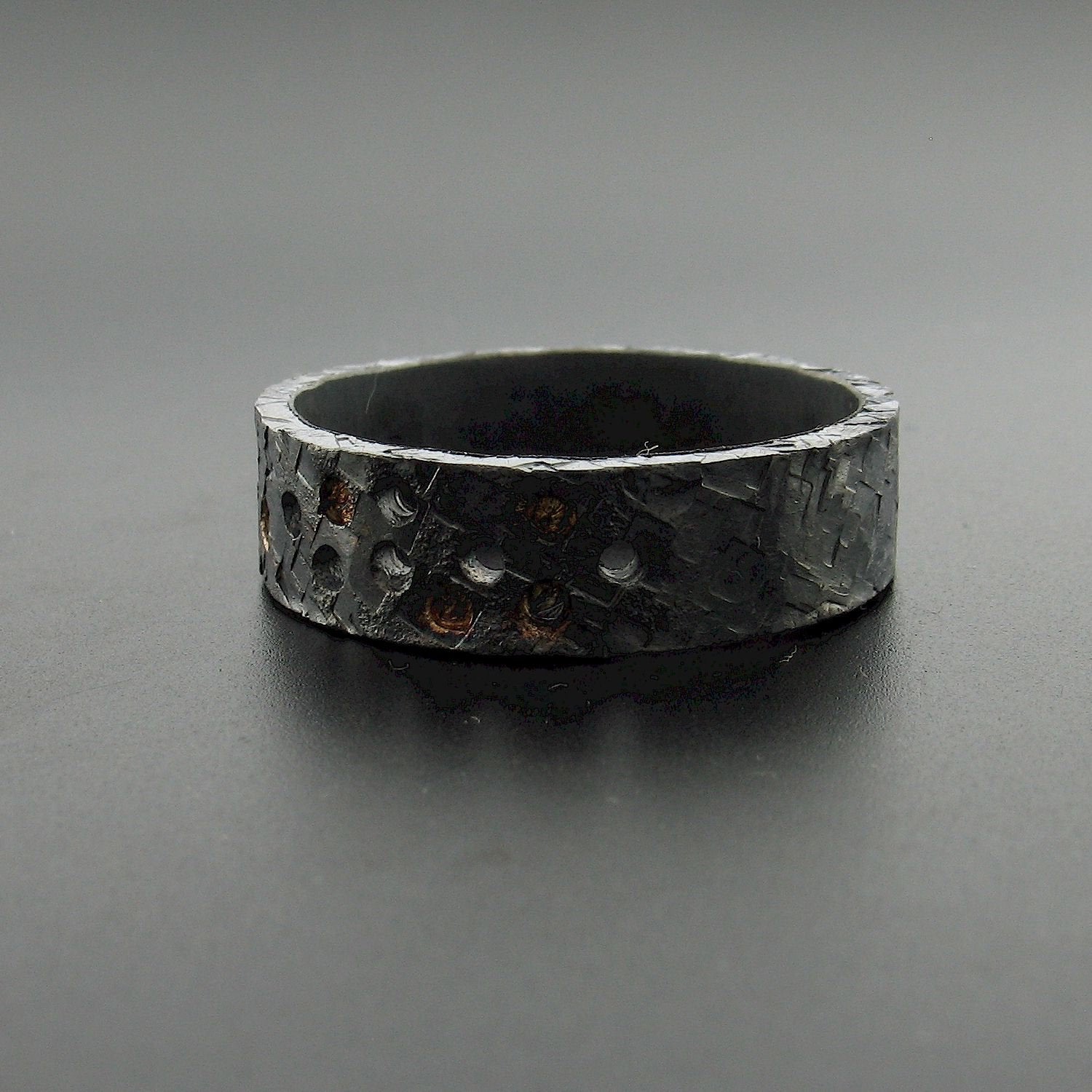 Black hammered wide wedding ring Night Stars design. Mens Designer Rings Wedding Ring