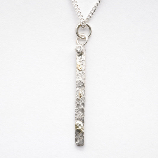 Diamond set silver and gold pendant, Sunrise long drop design