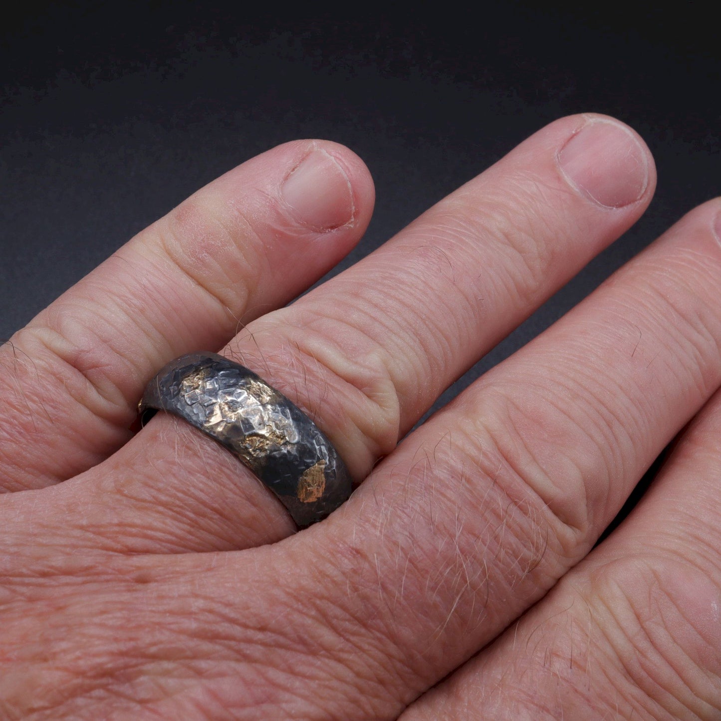 Wedding ring, black silver and gold hammered Night Sky design.