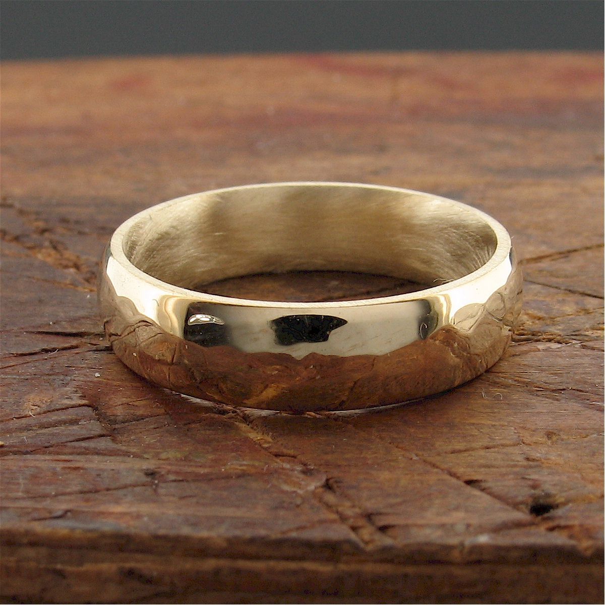 Gold broad wedding ring, Pebble design Designer Wedding Rings CumbrianDesigns