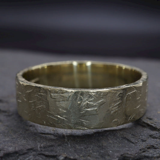 Yellow gold broad wedding ring - rustic flat hammered textured band - Windermere design.