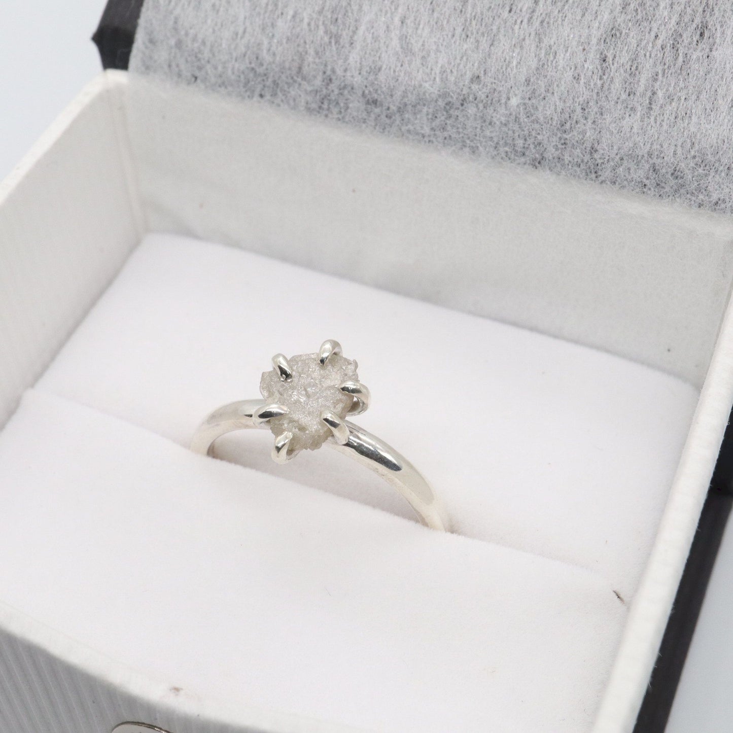 White uncut raw diamond solitaire six claw ring, 0.90ct.