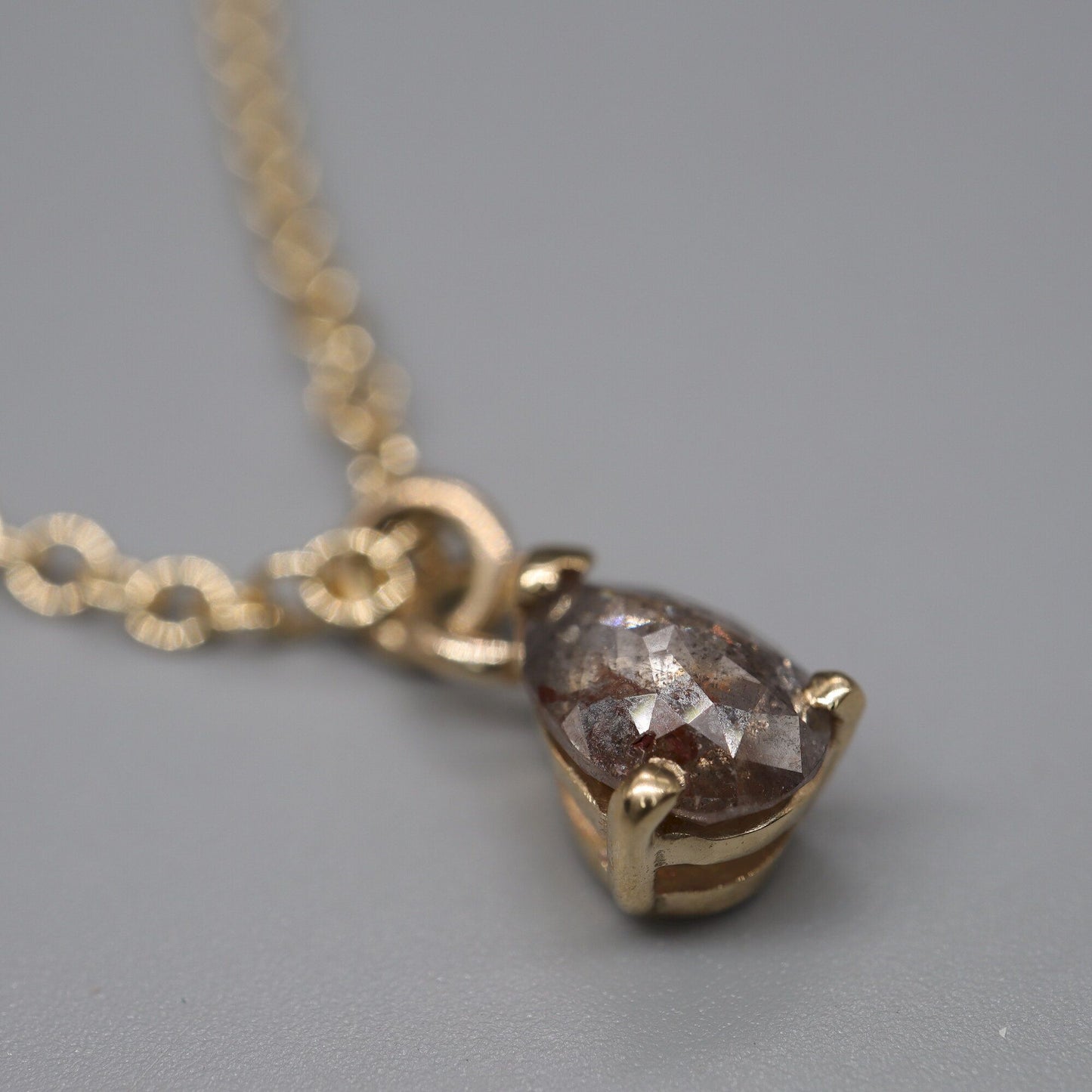 Salt and Pepper pear shaped diamond pendant in yellow gold with chain