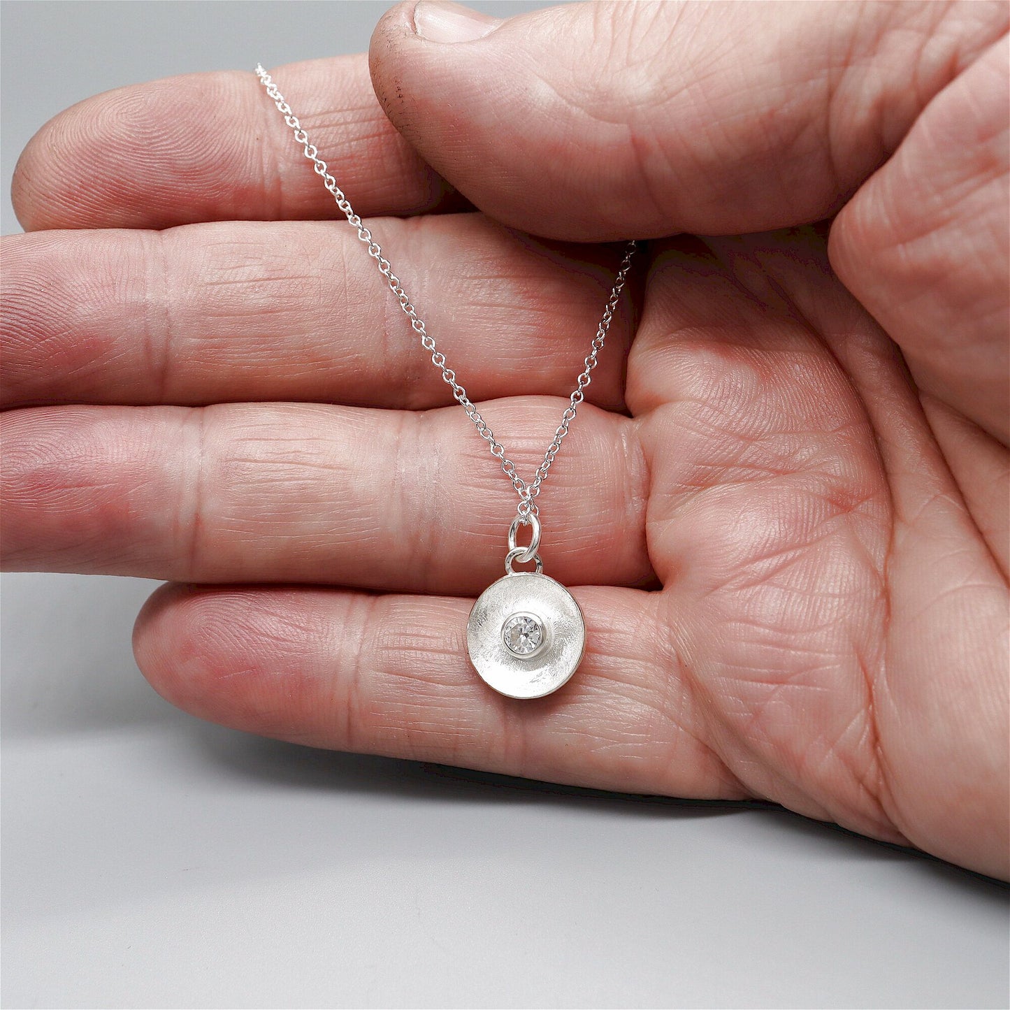 White Sapphire pendant, silver Water Droplets design.