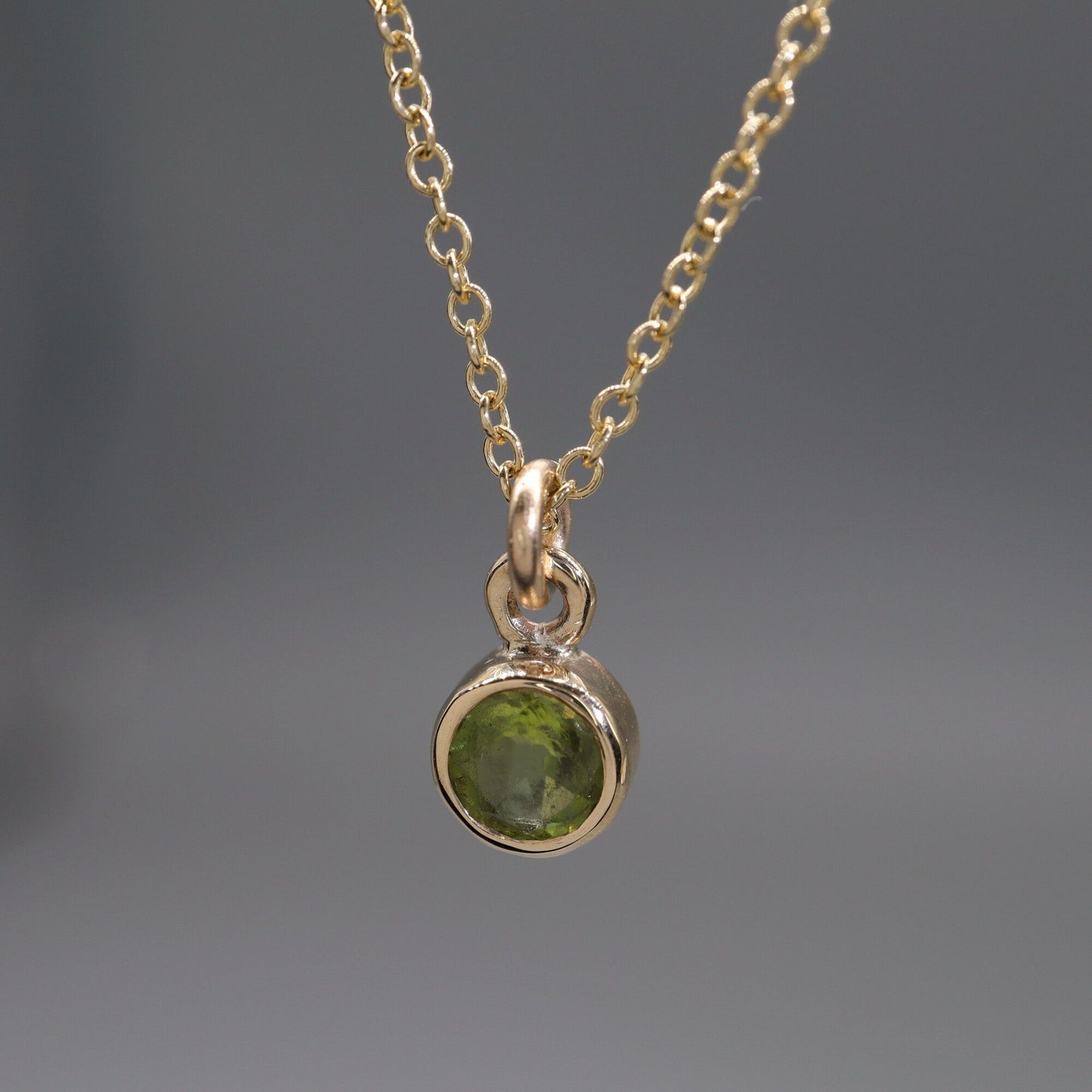 Yellow gold Peridot pendant with chain. August Birthstone