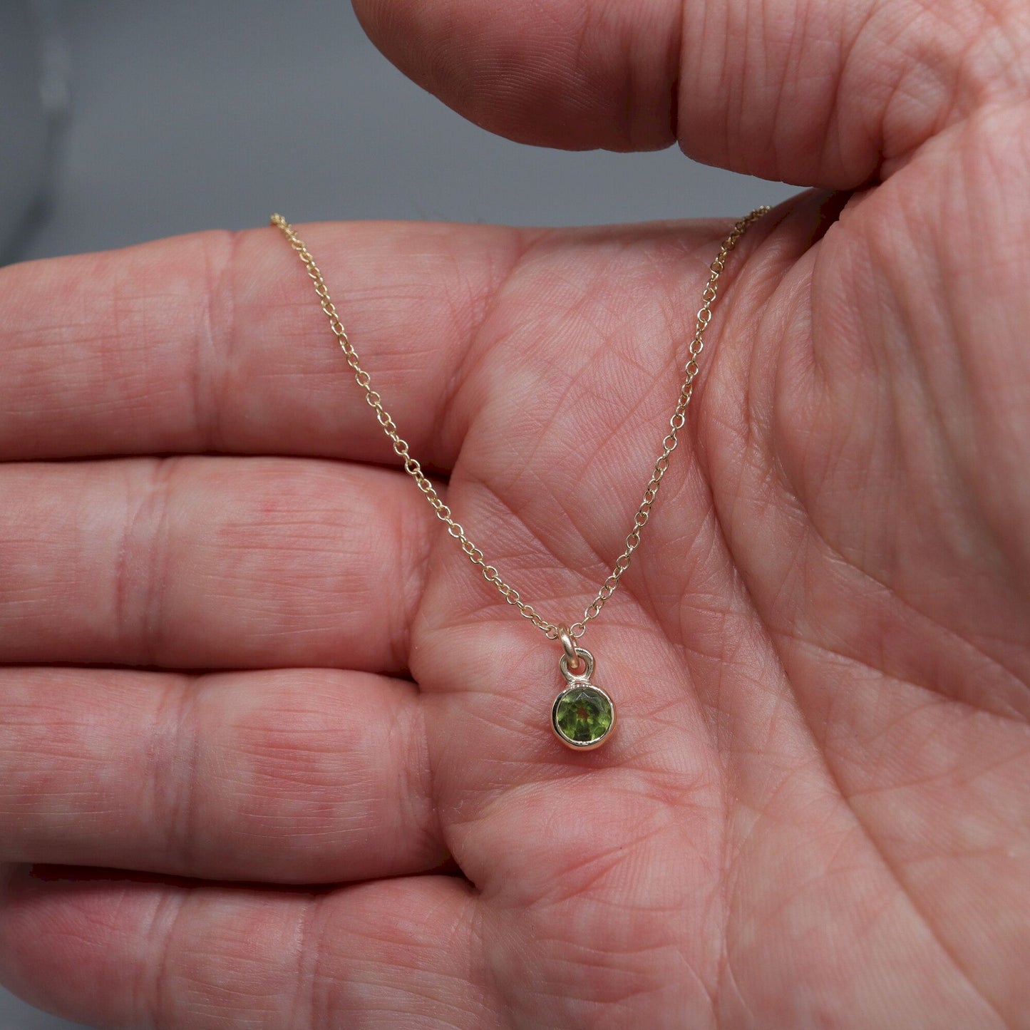 Yellow gold Peridot pendant with chain. August Birthstone