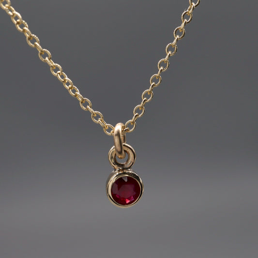Yellow gold natural Ruby pendant with chain. July Birthstone