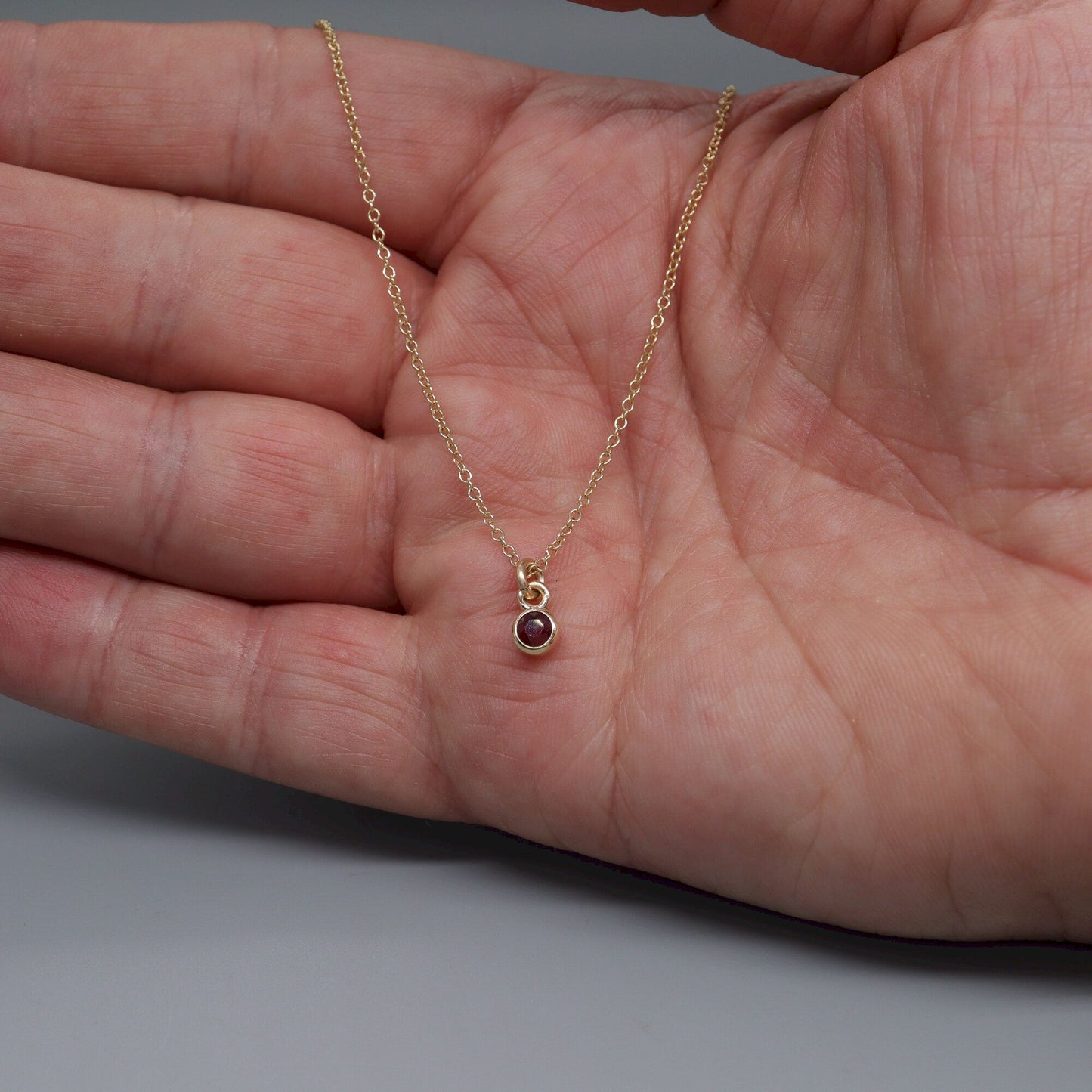 Yellow gold natural Ruby pendant with chain. July Birthstone
