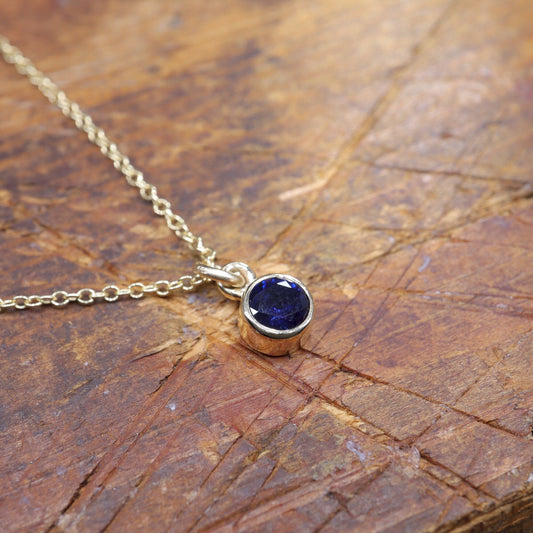 Sapphire gold pendant with chain. Birthstone for September.