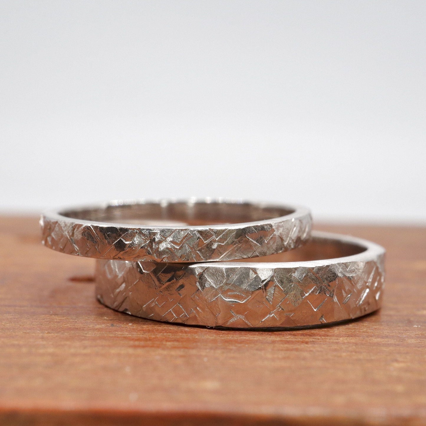 Silver matching Kendal rustic 2mm and 4mm wedding ring set - flat textured hammered design.