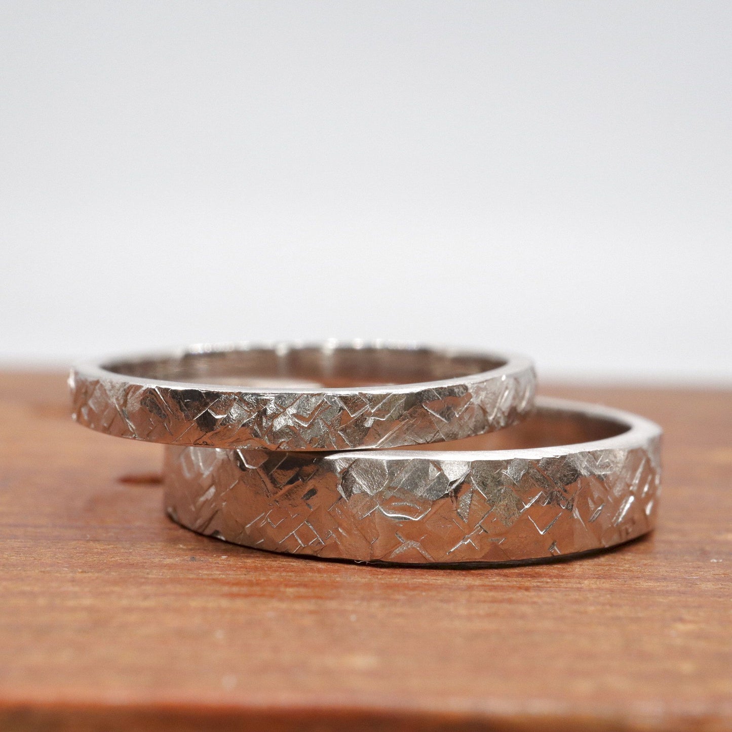 Matching Kendal gold design rustic hammered wedding ring set - flat textured men and womens rings.