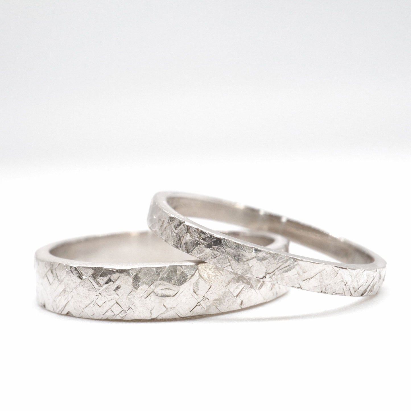 Matching Kendal Rustic Hammered 2mm and 4mm wedding ring set - flat textured white gold men and womens design.