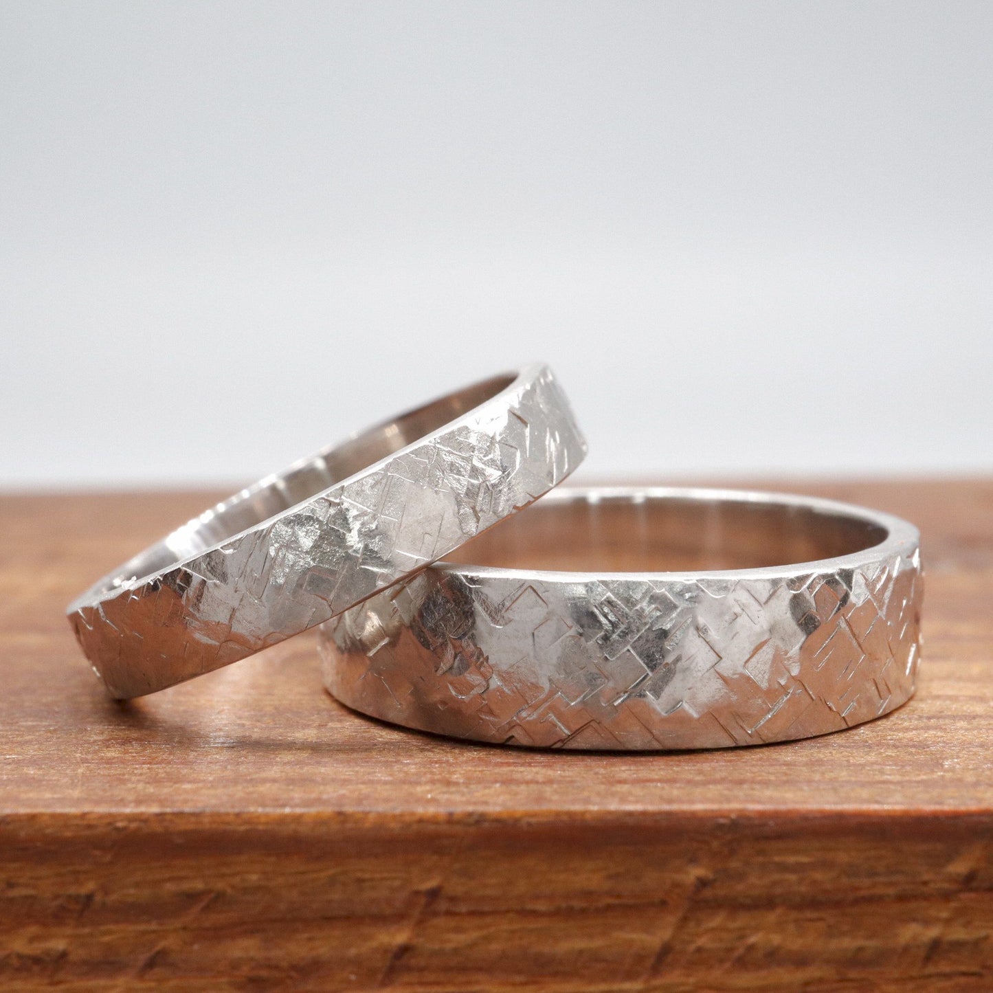 White gold matching Kendal design rustic hammered wedding ring set - flat textured 4mm and 6mm men and womens rings.
