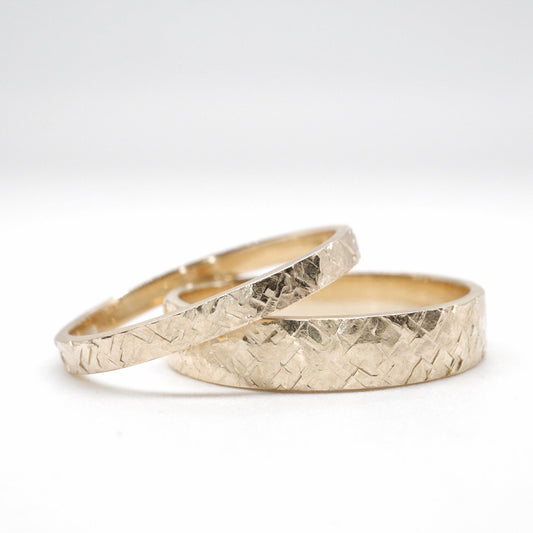 Matching Kendal gold design rustic hammered wedding ring set - flat textured men and womens rings.