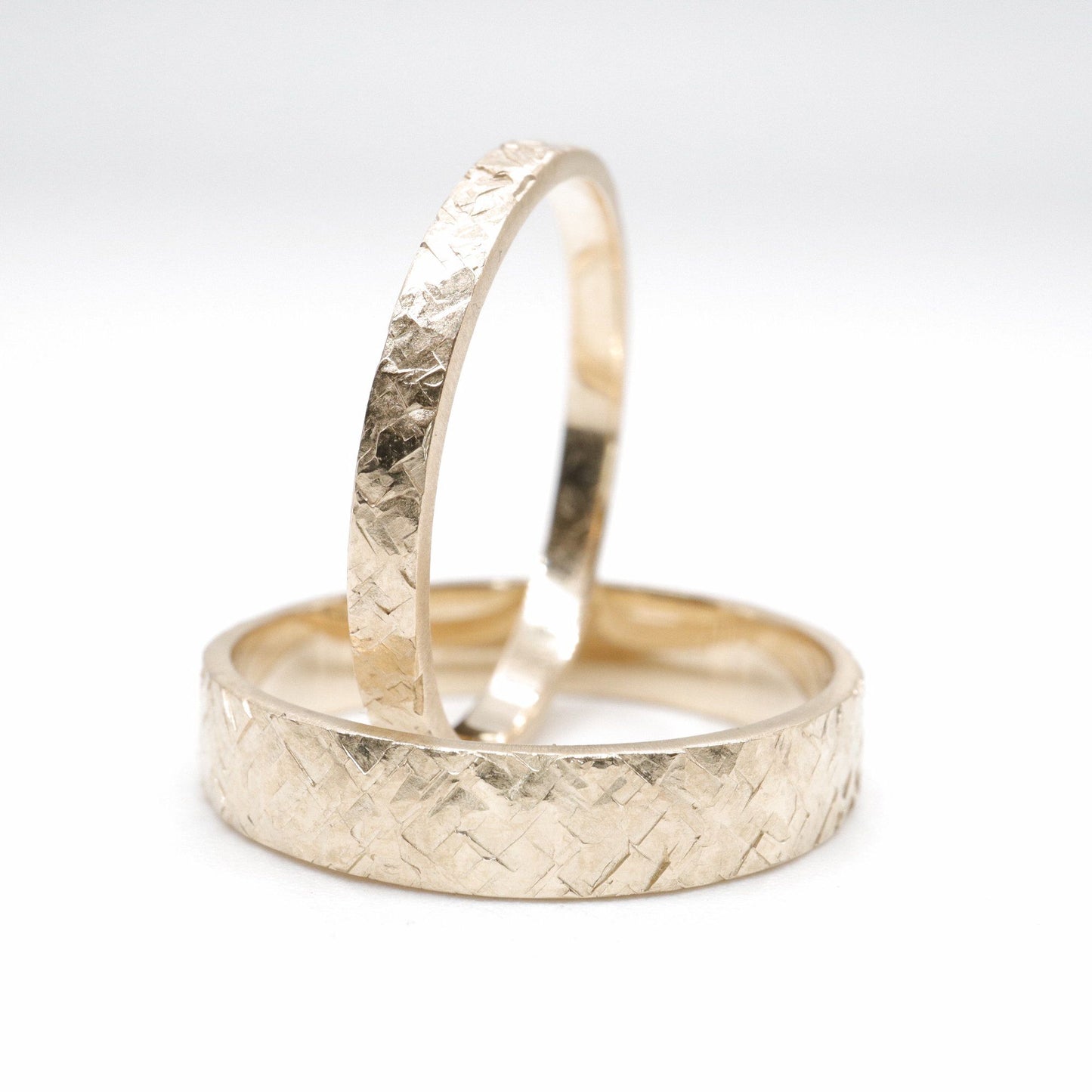 Matching Kendal gold design rustic hammered wedding ring set - flat textured men and womens rings.