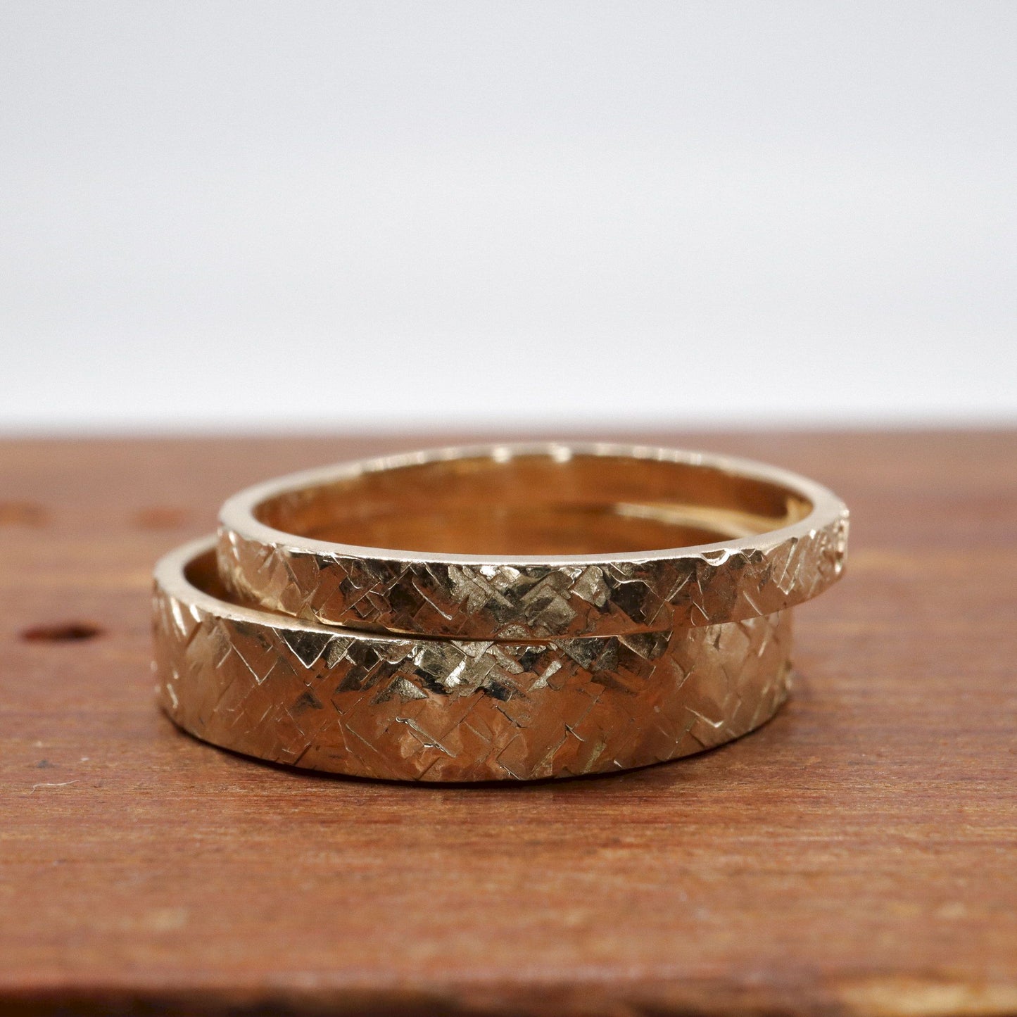 Yellow gold matching Kendal rustic hammered 2mm and 4mm wedding ring set - flat textured men and womens design.