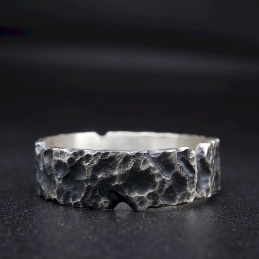 Lakeland Rock mens wedding, promise or engagement ring with a hand carved design.